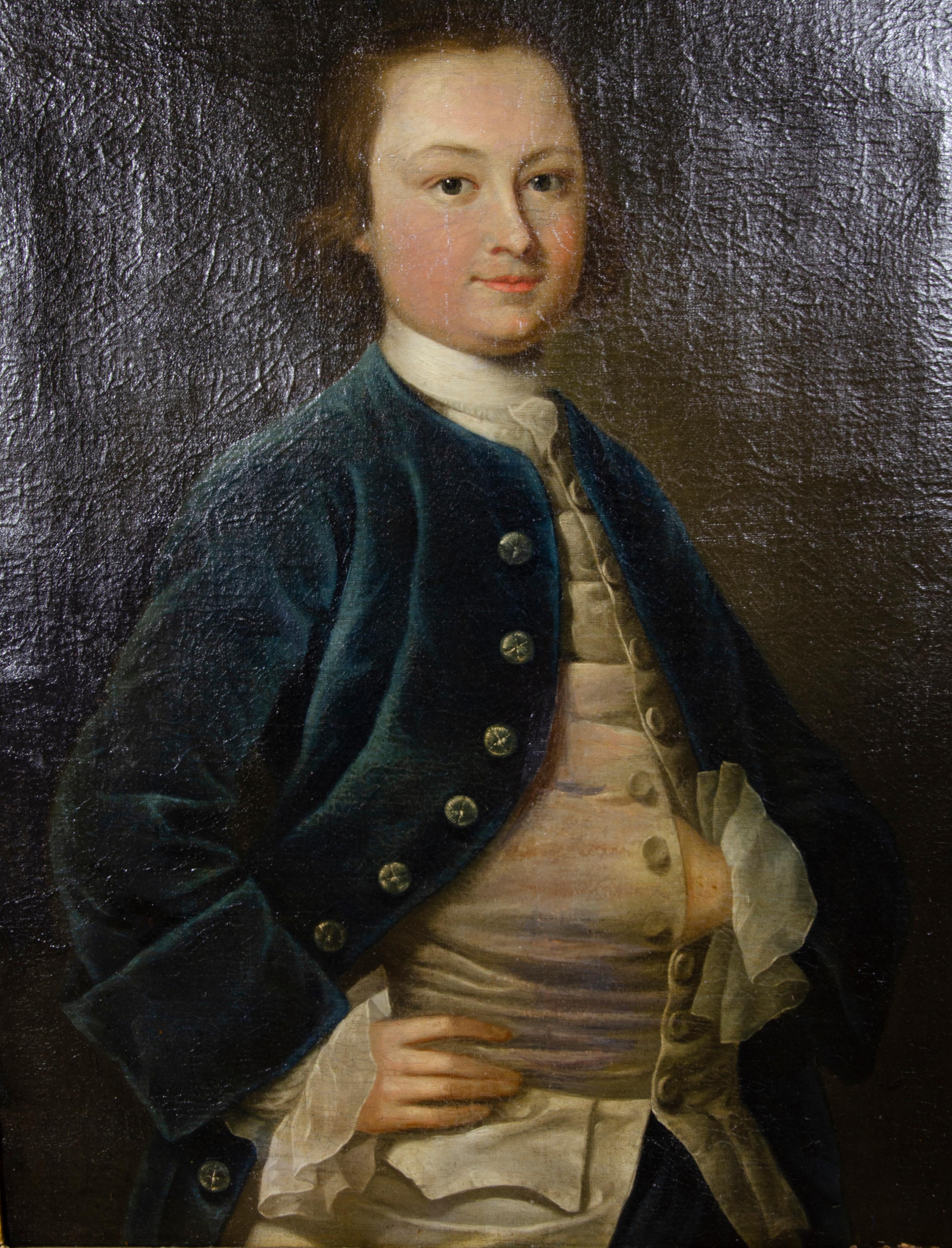 Gentleman standing with blue coat and hand tucked into his vest. In a period giltwood frame.