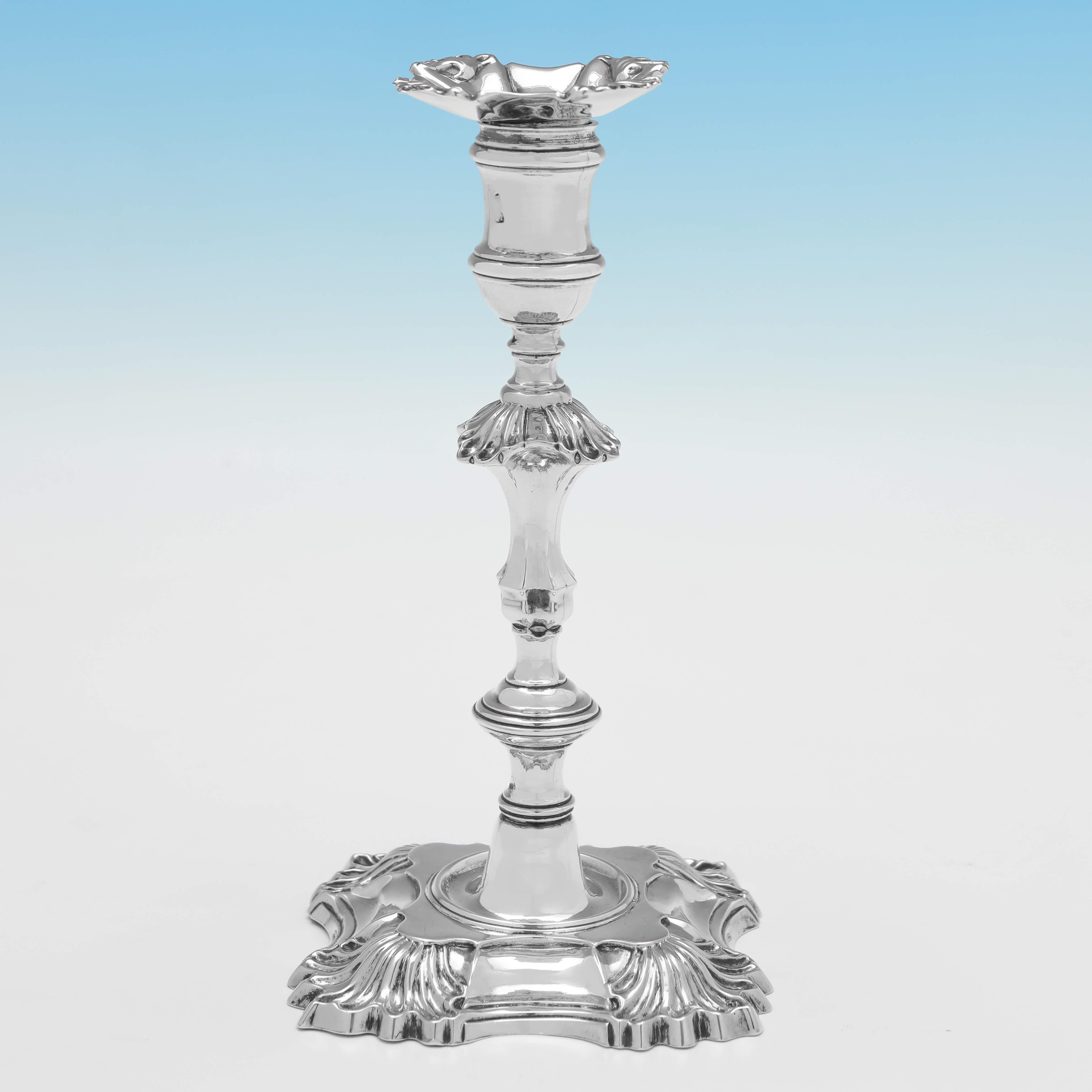 Hallmarked in London in 1751 by William Gould, this charming pair of George II period, cast, Antique Sterling Silver Candlesticks, are in the '4 Shell' style, and feature removable nozzles. 

Each candlestick measures 8