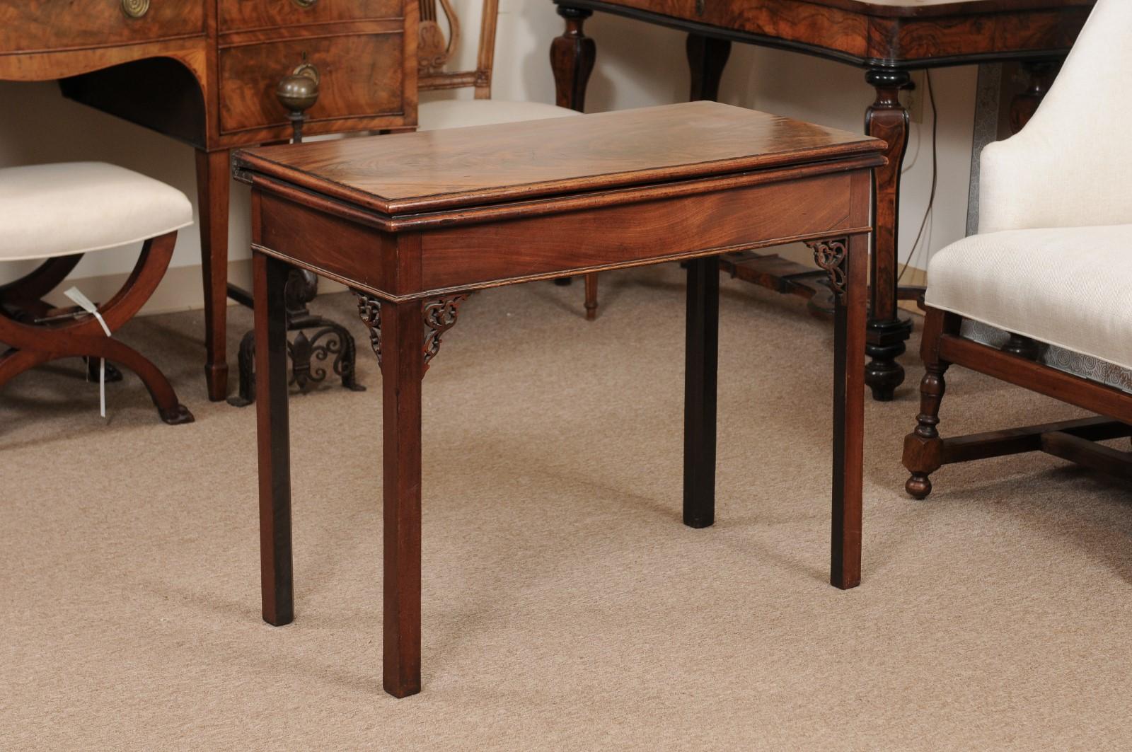 18th century English George II period flip-top tea table with fretwork.