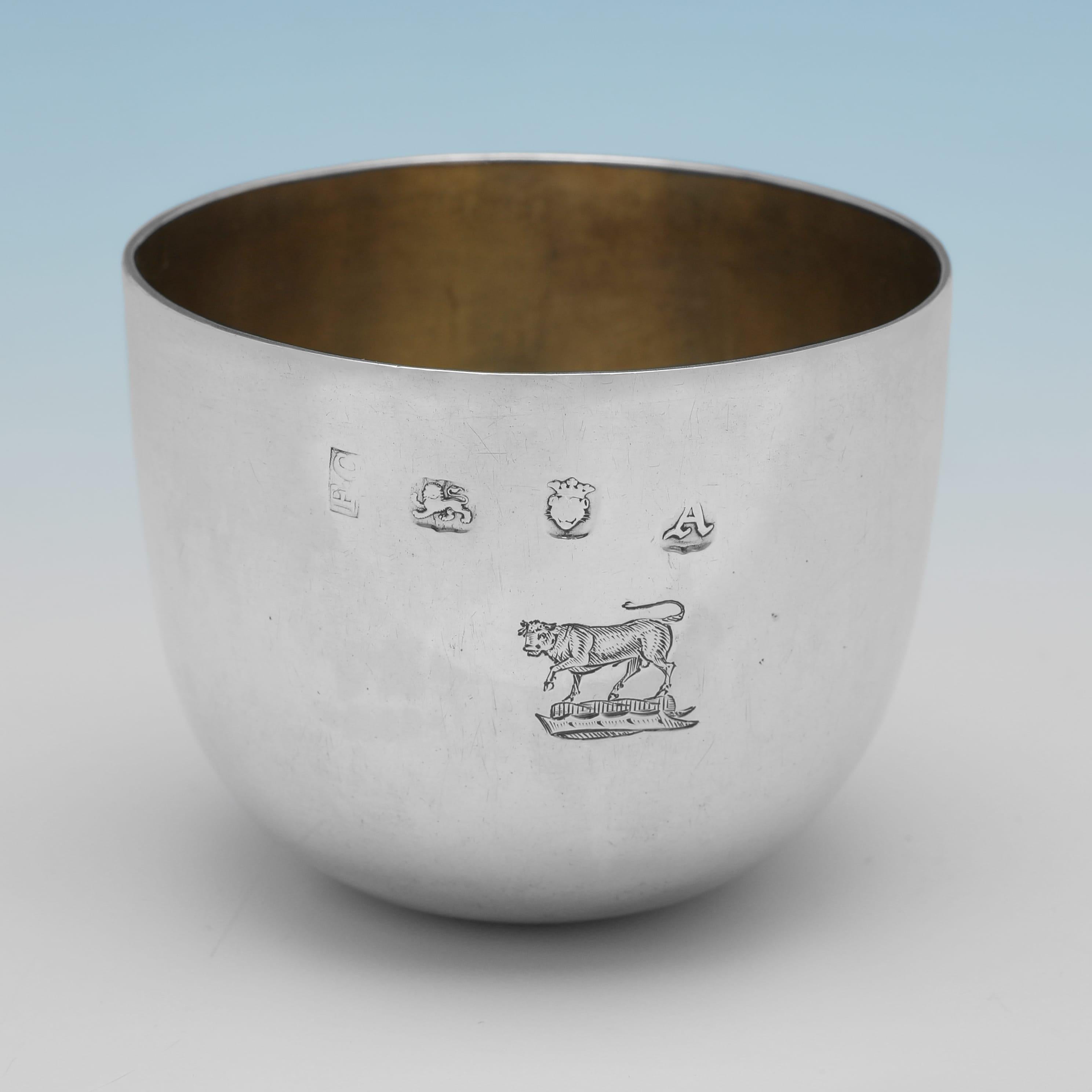 Hallmarked in London in 1756 by Francis Crump, this very handsome, George II Period, Antique, Sterling Silver Tumbler Cup, is of traditional form, and is engraved to both sides with family crests. 

The tumbler cup measures 2