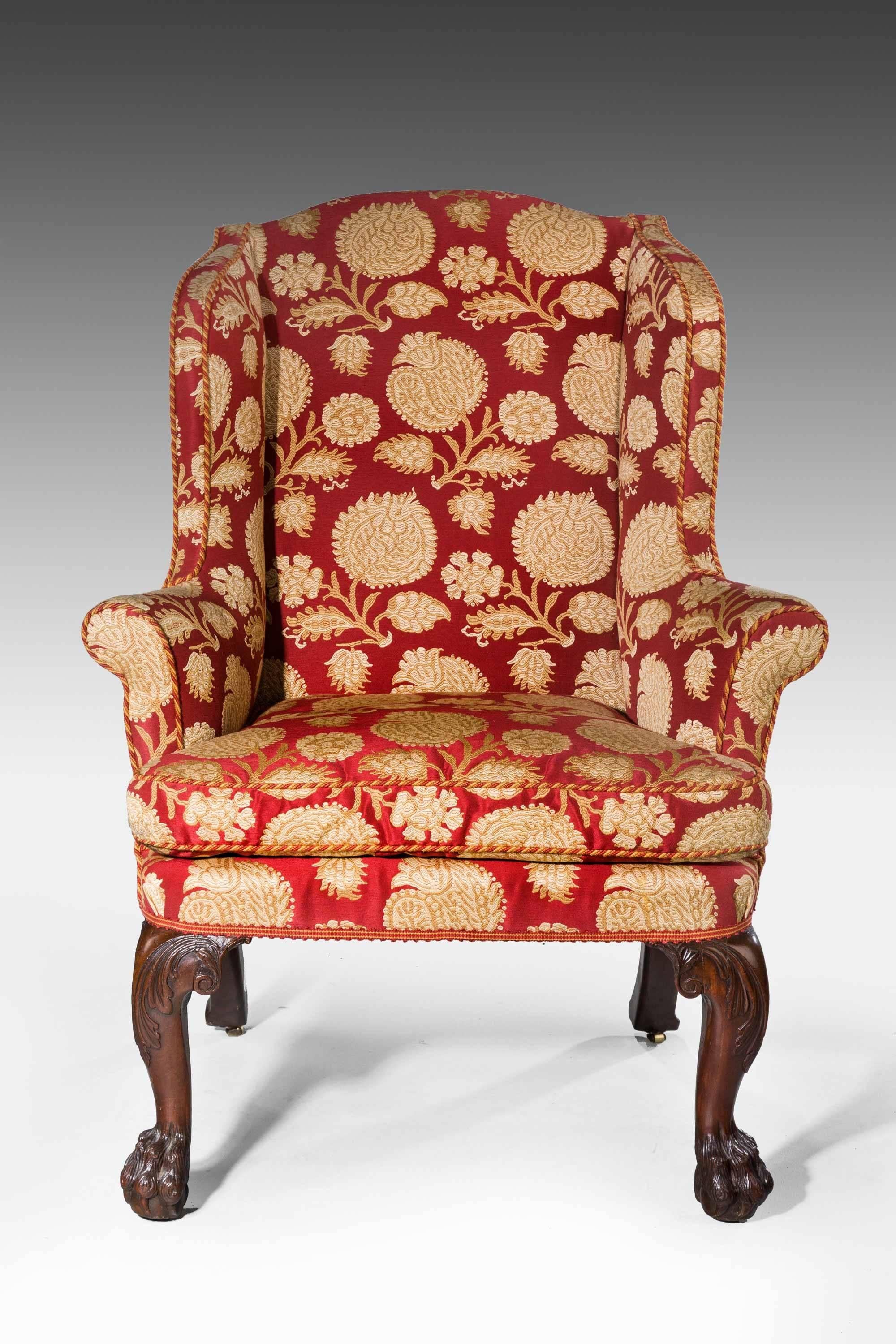 George II period wing chair of good proportions, cabriole supports with scroll work to upper section. Walnut.