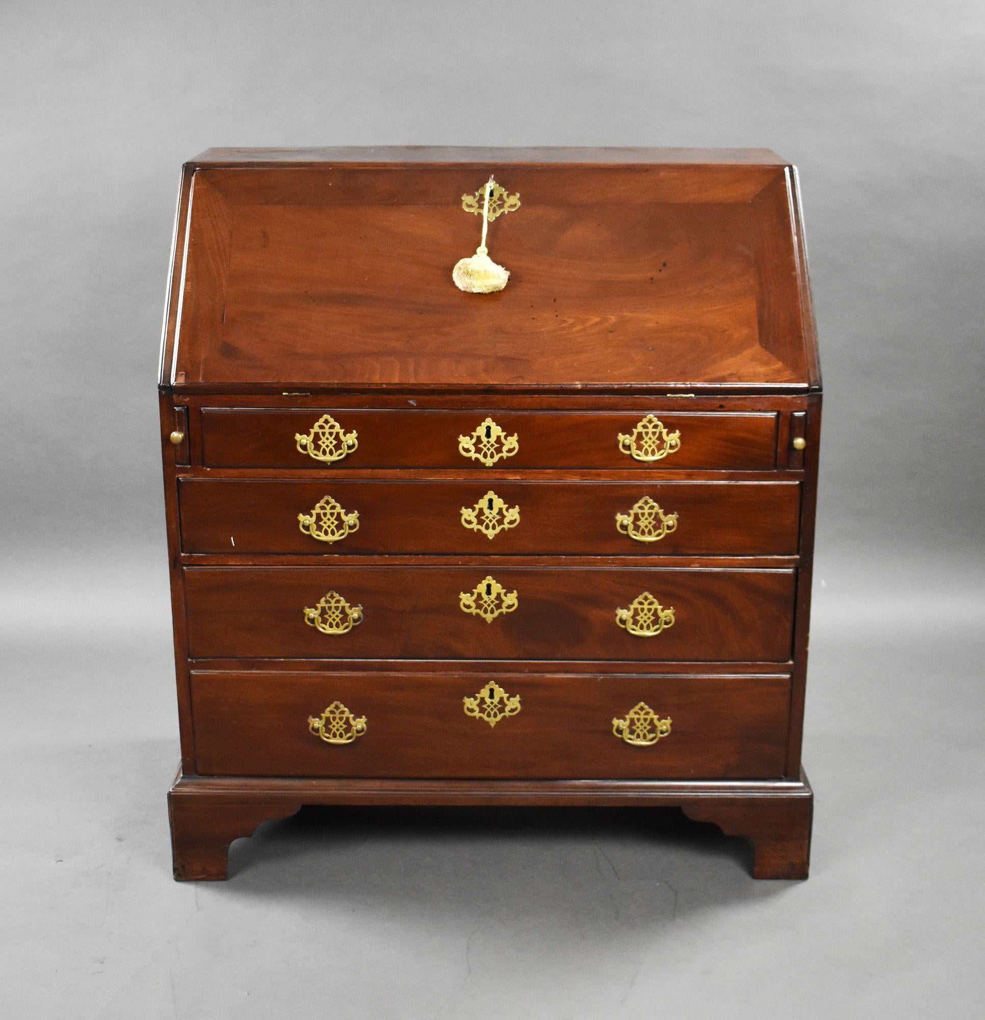 For sale is a good quality George II red walnut bureau, with a hinged fall enclosing a well fitted interior of drawers and pigeon holes and secret compartments, with four drawers below, raised on bracket feet. This piece remains in very good