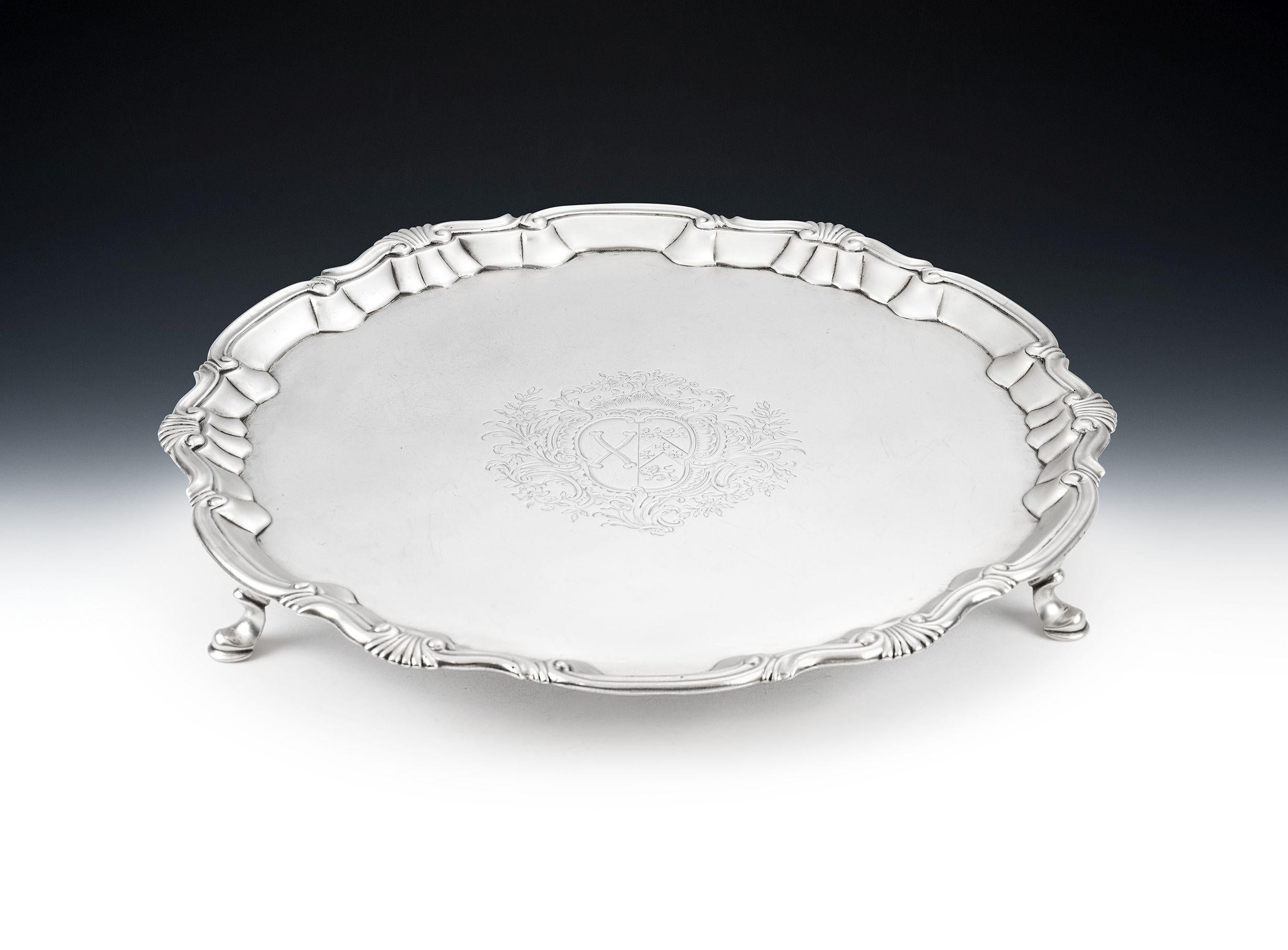 A Very Fine George II Salver Made by William Peaston in London in 1752.

The Salver stands on three cast hoof feet and is circular in form with a raised rim decorated with scrolls and shells, typical of the late George II period.  The centre of the