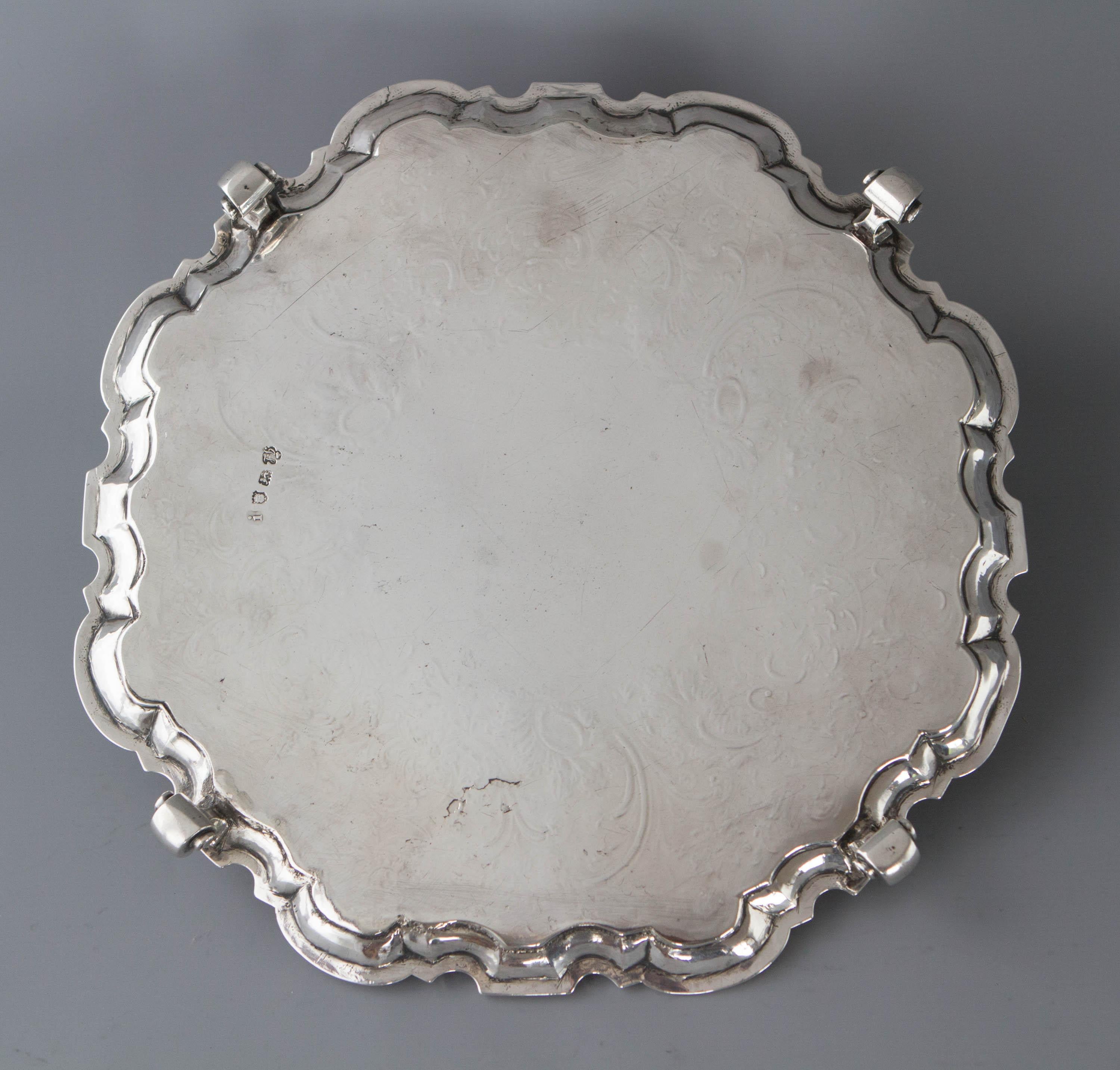 A superb George II silver salver of octagonal form with scrolling pattern rim and the whole resting on four scroll feet. The centre engraved with the Cockburn Armorial above 'Vigilans et Audax' meaning 'Vigilant and Bold', surmounted by the Cockburn