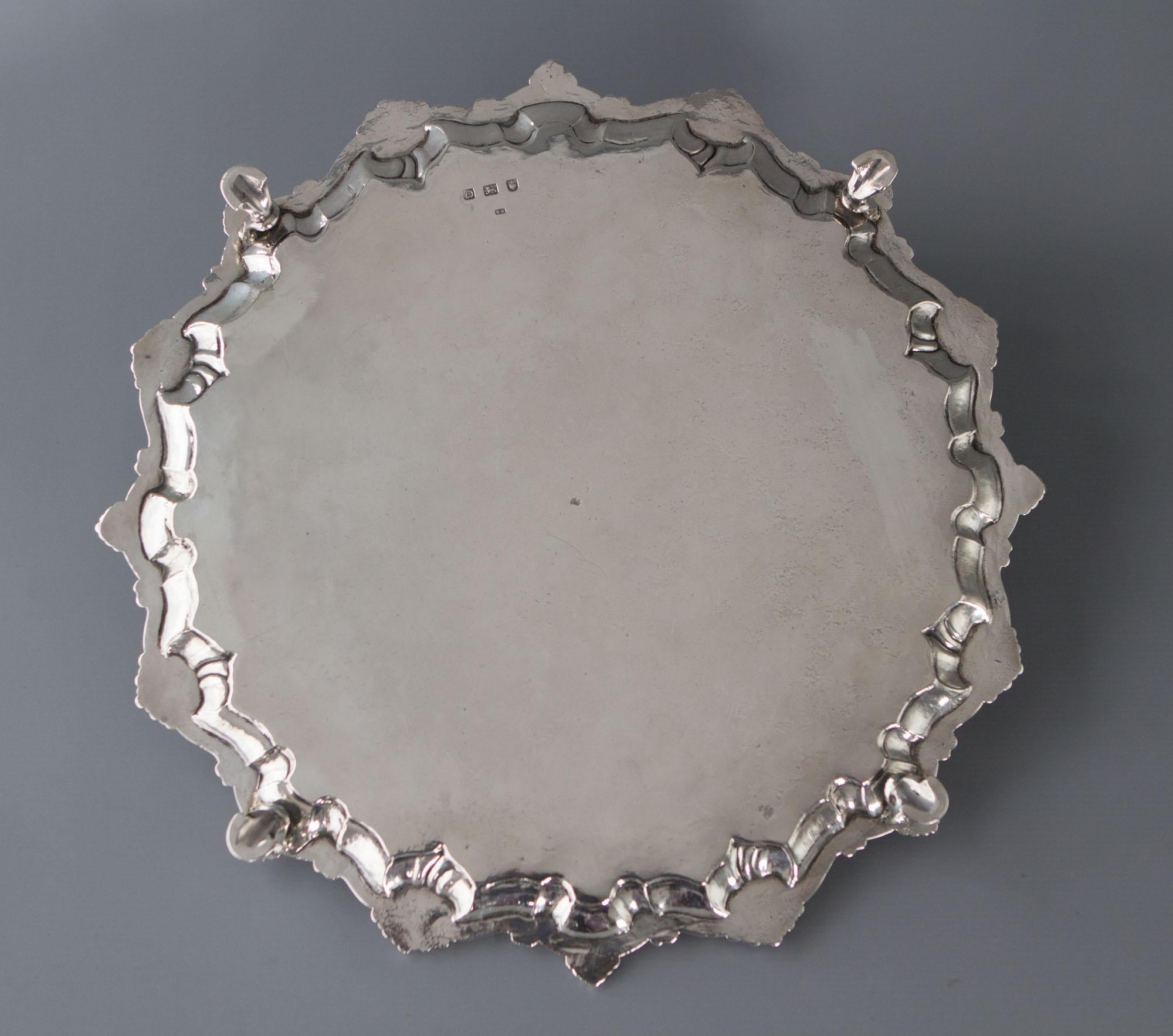 An excellent silver salver with scrolling shell pattern rim and the whole resting on four hoof feet. The center engraved with an armorial. (see pictures) The armorial is surrounded by a beautiful floral engraved design. 

Hallmarked for London