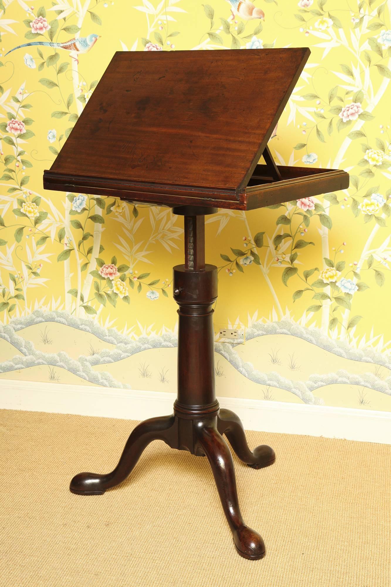 Rare George II Solid Mahogany Dictionary Stand, having a hinged racheted top platform on an adjustable riser, and supported on a turned turret baluster above a tripod base with heavy cabriole legs ending in rounded pad feet and brass castors,