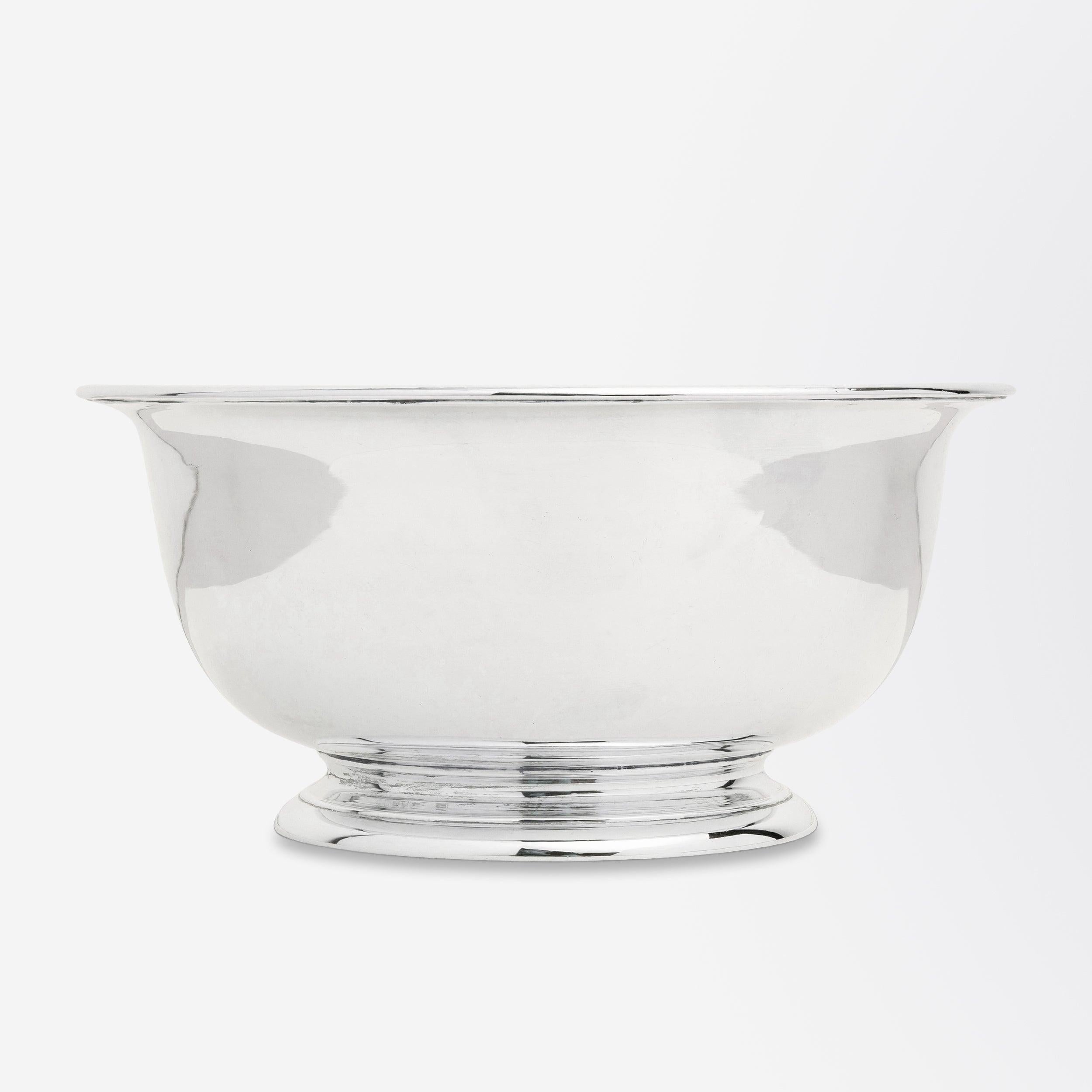 Crafted during the reign of George II, this sterling silver footed bowl was manufactured by London silversmith John Barbe. The small footed bowl is almost entirely without ornamentation and could be described as being similar to a Paul Revere bowl,