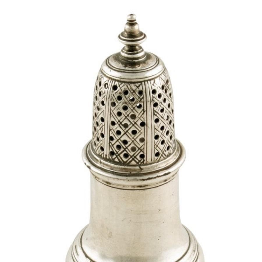 A mid 18th century George II sterling silver hall marked pepper caster.

The caster has hall marks for London, the year 1754 and the maker's mark for James Wilks.

The caster is baluster in shape with a finial to the top and a moulded raised