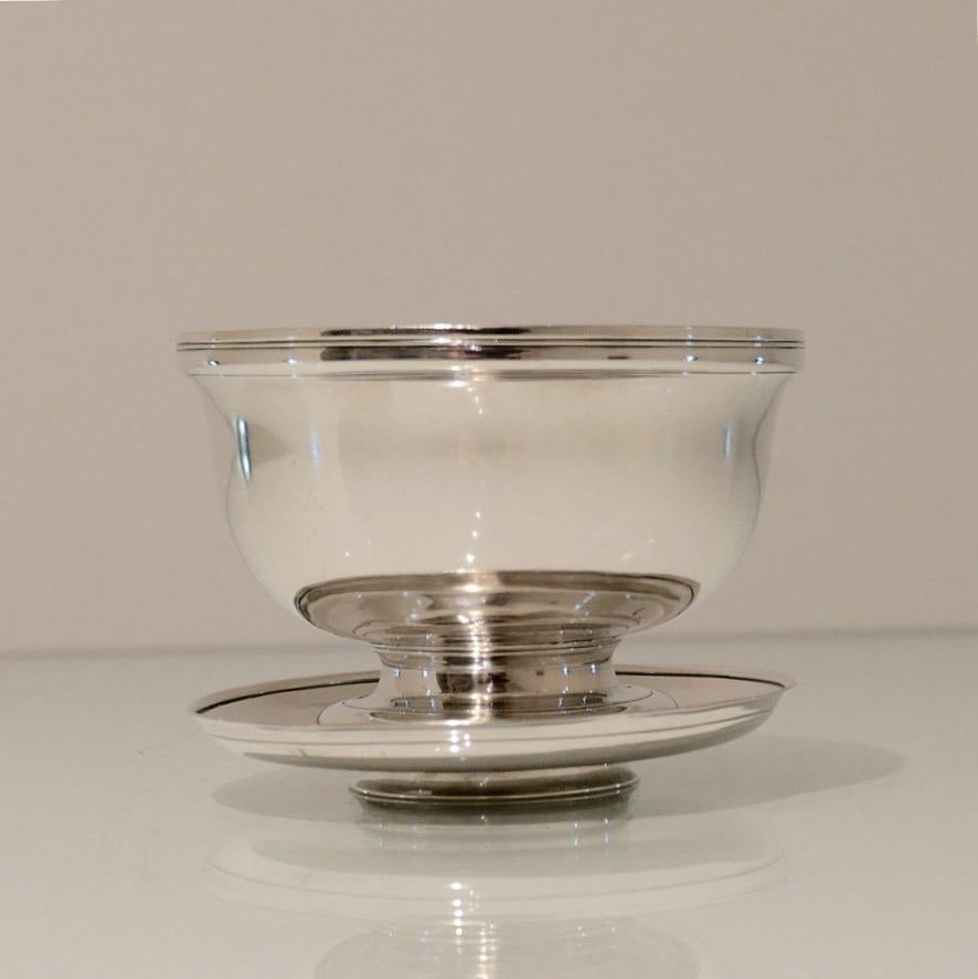 A truly sweet early George II sterling silver sugar bowl and cover beautifully plain formed in design. The detachable lid can be used as an under plate (saucer) and completes a wonderful piece of craftsmanship.

 Weight 8.5 troy ounces/261