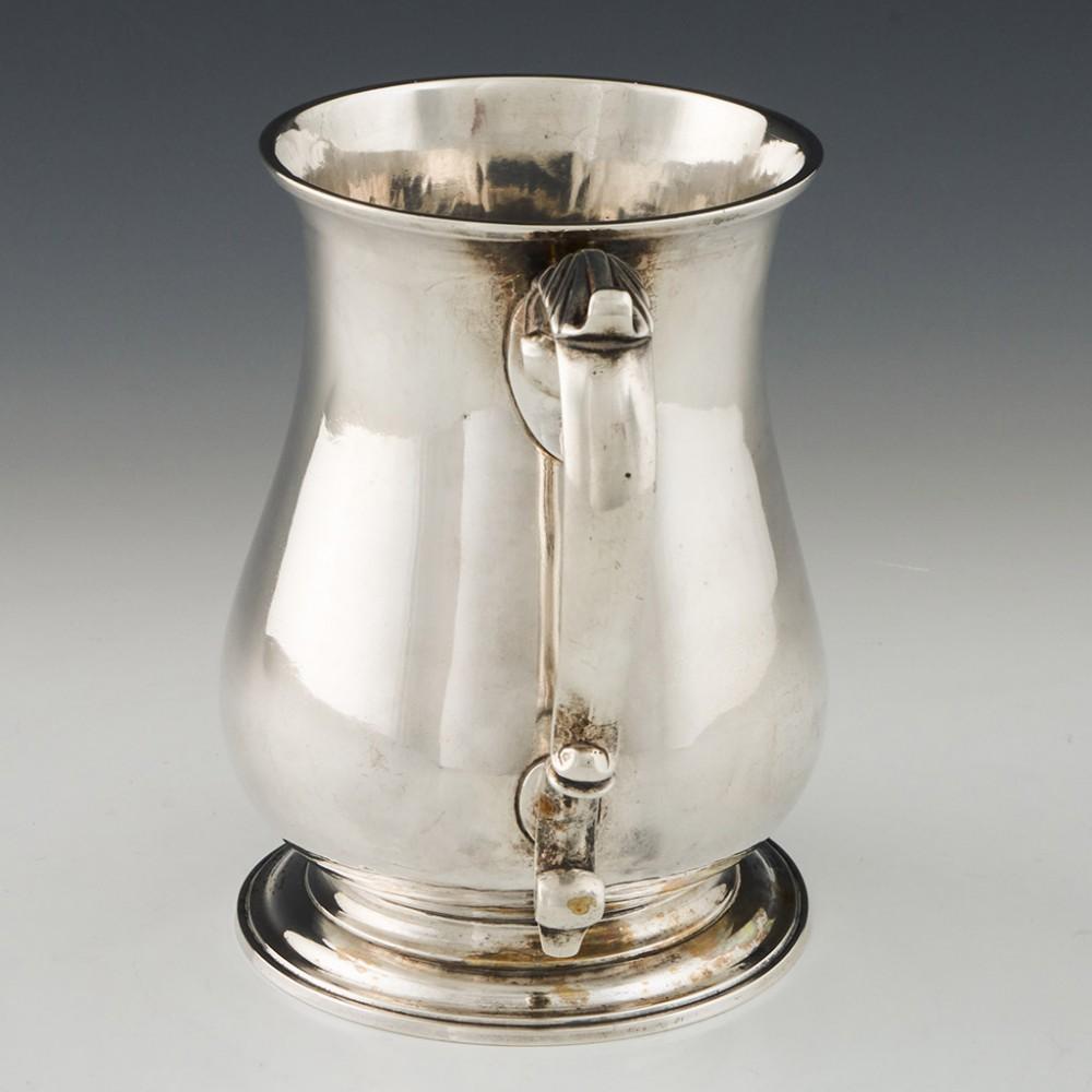 George II Sterling Silver Tankard London, 1744

Additional Information:
Date: Hallmarked in London in 1744 for Thomas Whipham
Period: George II
Origin: London, England
Decoration: Scroll handle with acanthus leaf thumb rest, terraced