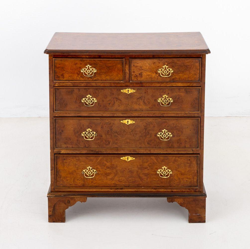 George II Style Burl Walnut Chest of Drawers, 20th century, having two short drawers above three frieze drawers on four bracket feet. 33.75