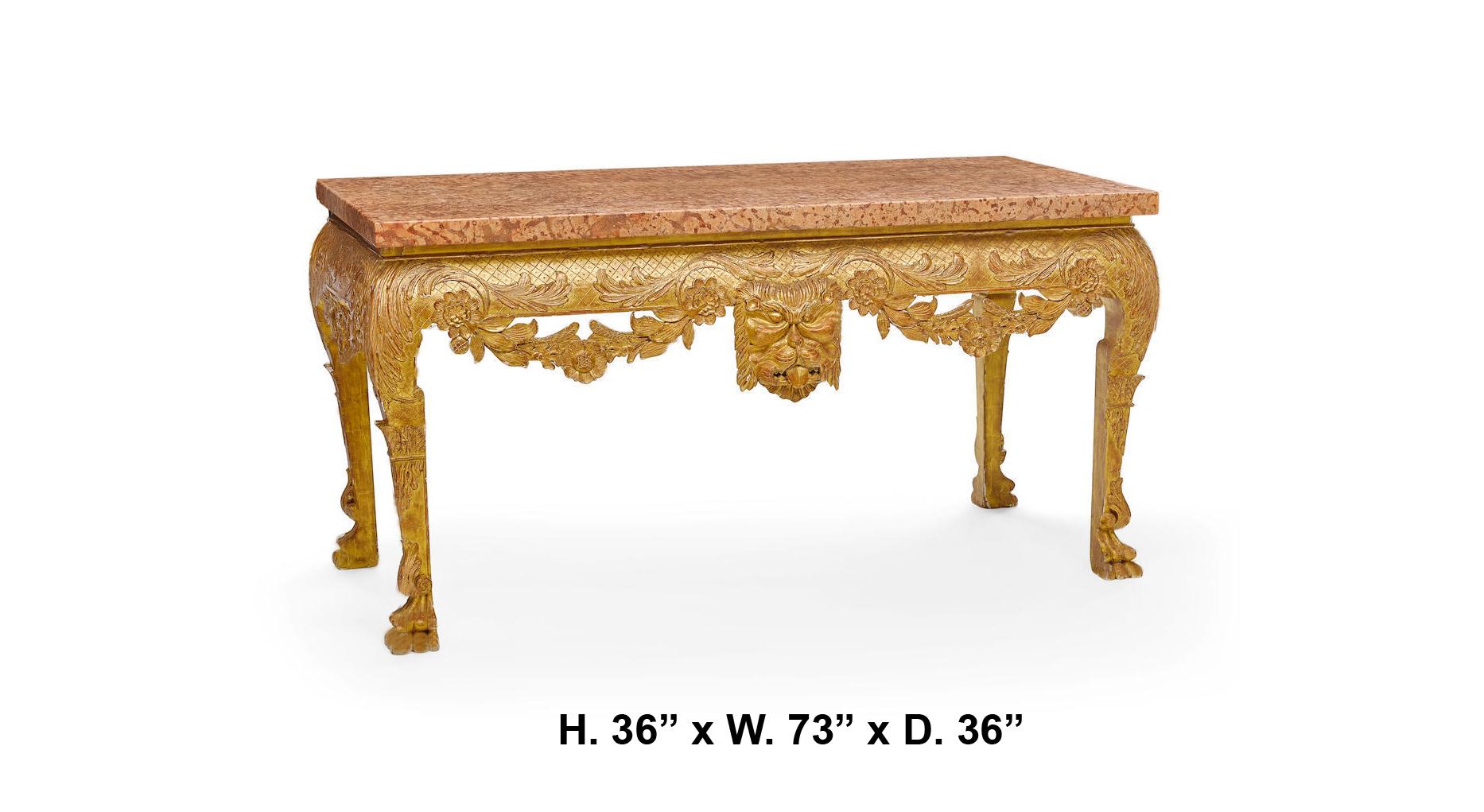 Impressive George II style finely carved giltwood console with thick marble top, meticulous attention to detail decorated with floral swags in the front and the sides centered with attractive large mask, resting on carved feet.
Bearing a Sotheby's