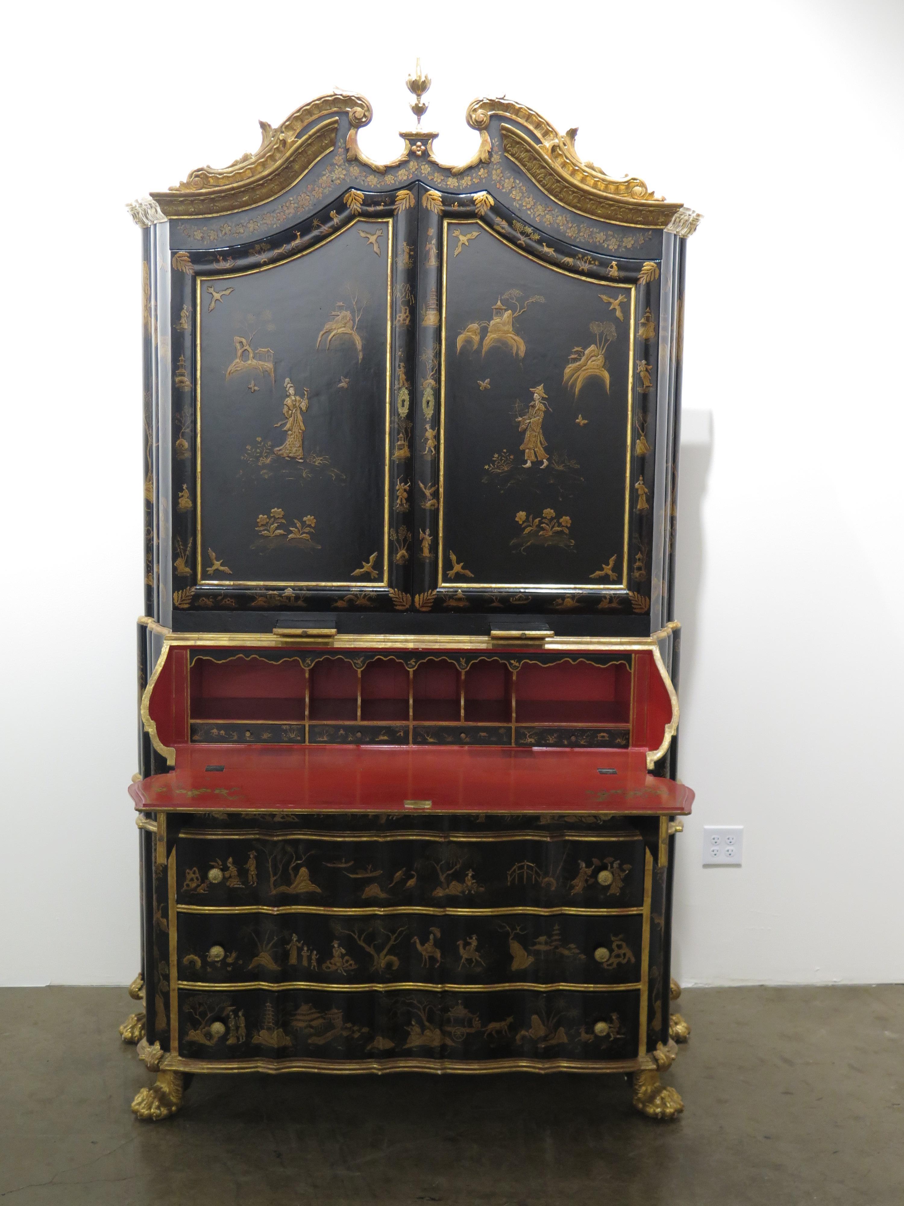 a George II-style black lacquer secretary / desk with Collector's Cabinet above, gilt Chinoiserie decoration overall, some raised, cabinet above fitted out with display shelves for Chinese porcelains (vases and figures) and finished in Chinese red