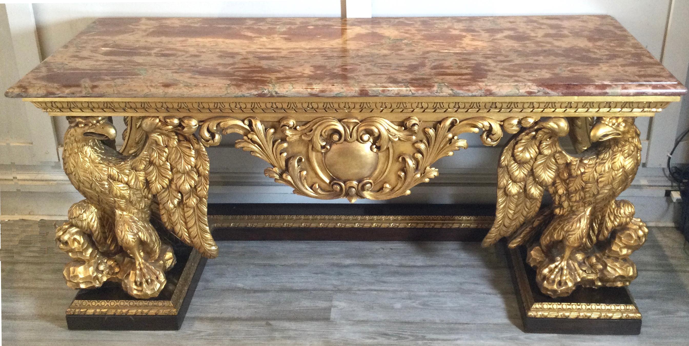 George II style gilt carved wood antique console with marble top, Circa 1926. The rectangular marble top above a frieze centering a cartouche, raised on a fully carved eagle supports. The marble is absolutely stunning.
Dimensions: H-35