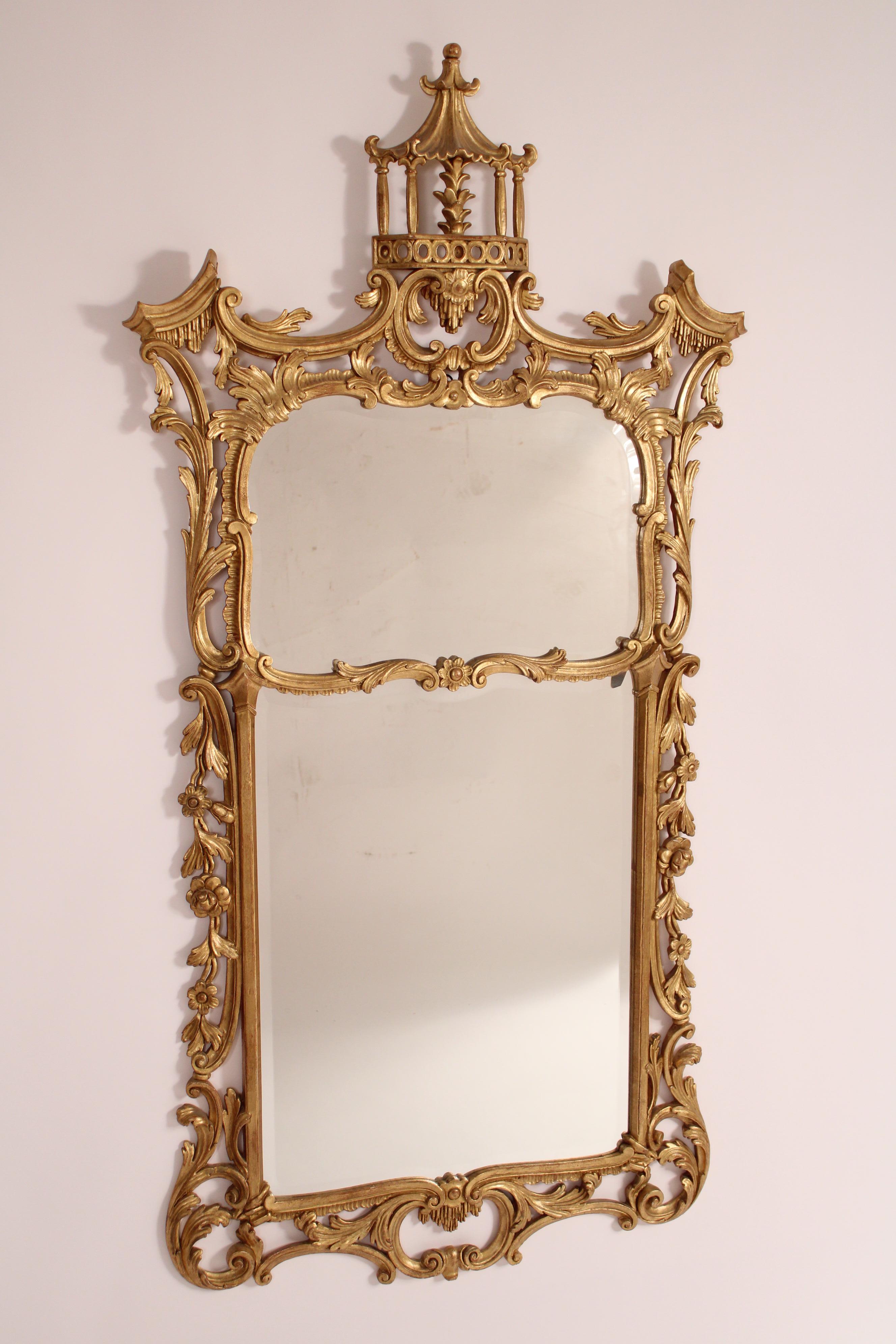 George II style gilt wood (Dutch Gold) mirror, made in Italy, circa 1970's. With a pagoda top, carved floral sides and rococo bottom, with beveled glass mirror.