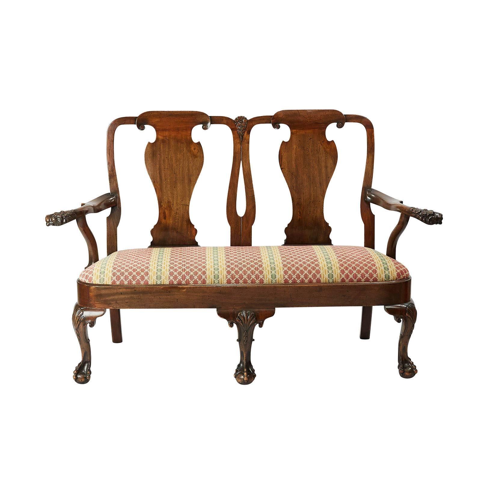 An exceptional Irish George II style settee with ball and claw feet and shell carved knees. The arms sweep out ending in lions heads, good color and patina, Ireland, circa 1890.

 