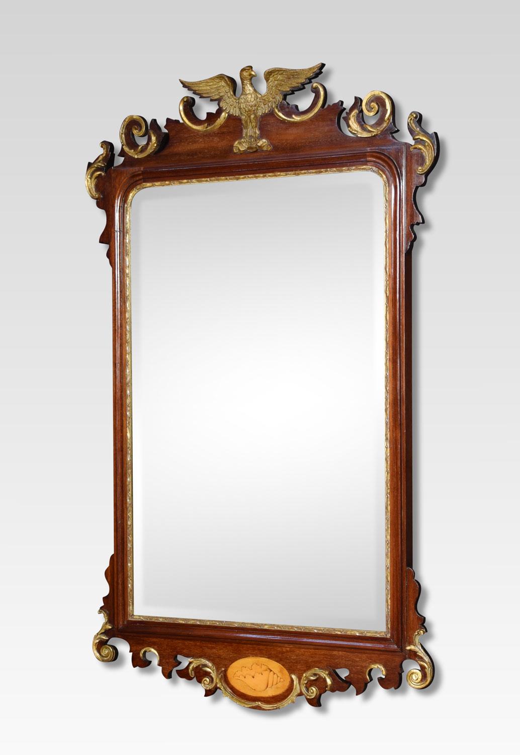 George II style mahogany and giltwood wall mirror. The shaped cresting rail surmounted with an eagle and leaf decoration. The rectangular mirror plate enclosed by scrolling mahogany frame.
Dimensions:
Height 43 inches
Width 27 inches
Depth 3
