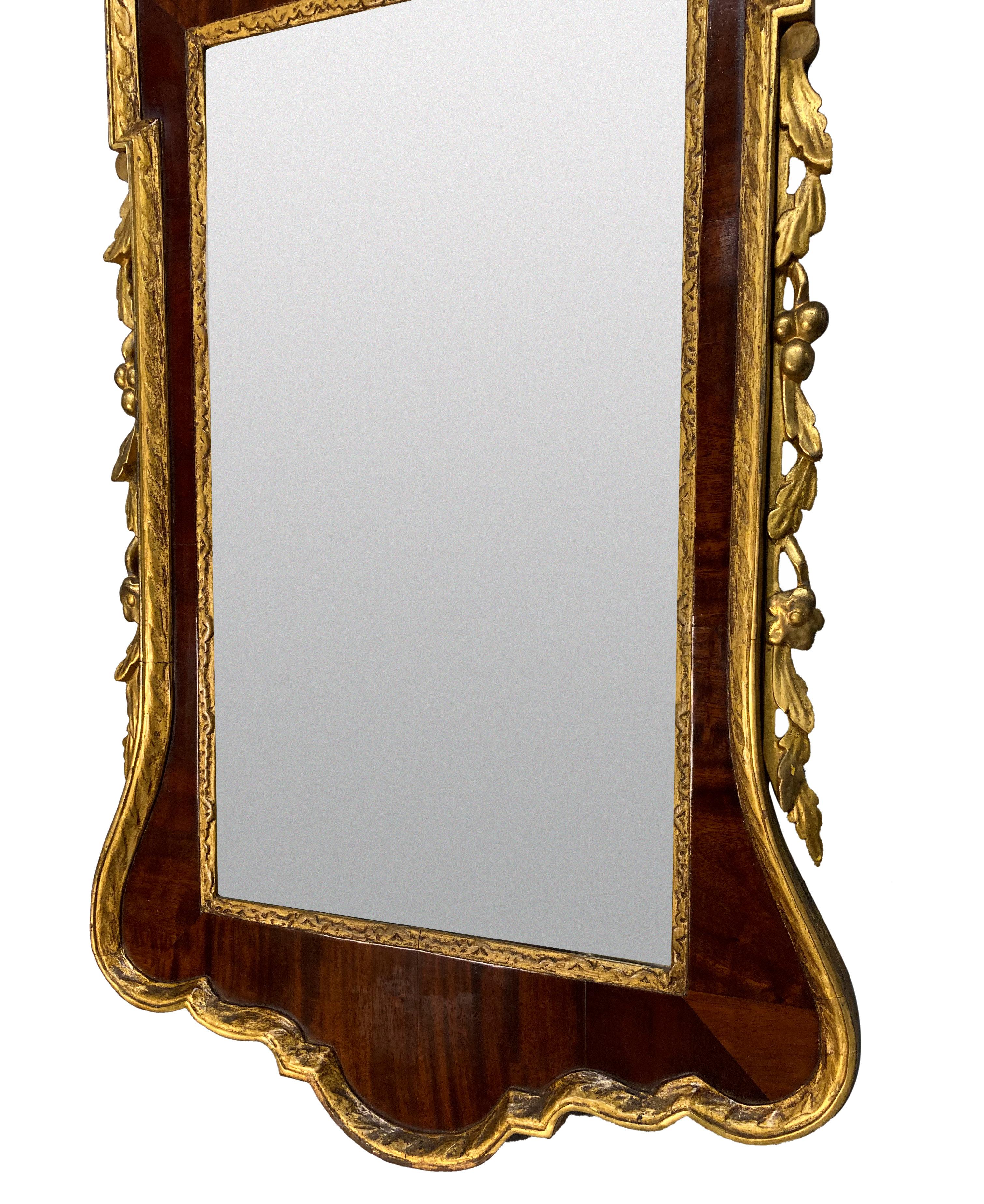 Early 20th Century George II Style Mahogany & Parcel Gilt Mirror For Sale