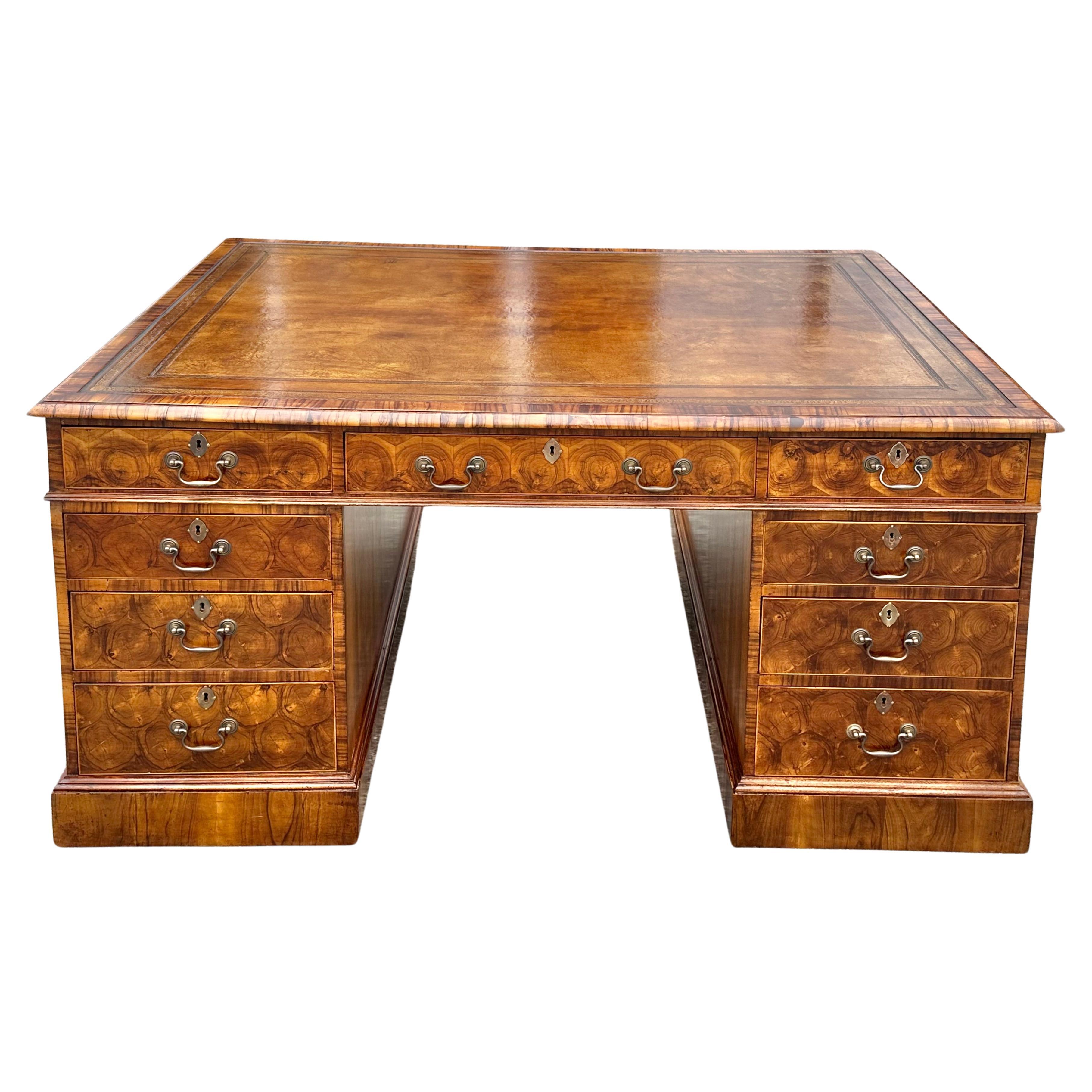 Magnificent Late 19th Century Oyster Walnut Partners Desk.  Beautiful matched and patterned oyster walnut veneer.  Two pedestals with graduated drawers on one side and cabinets on the opposite.  Top with drawers on both sides.  Mellow patina and