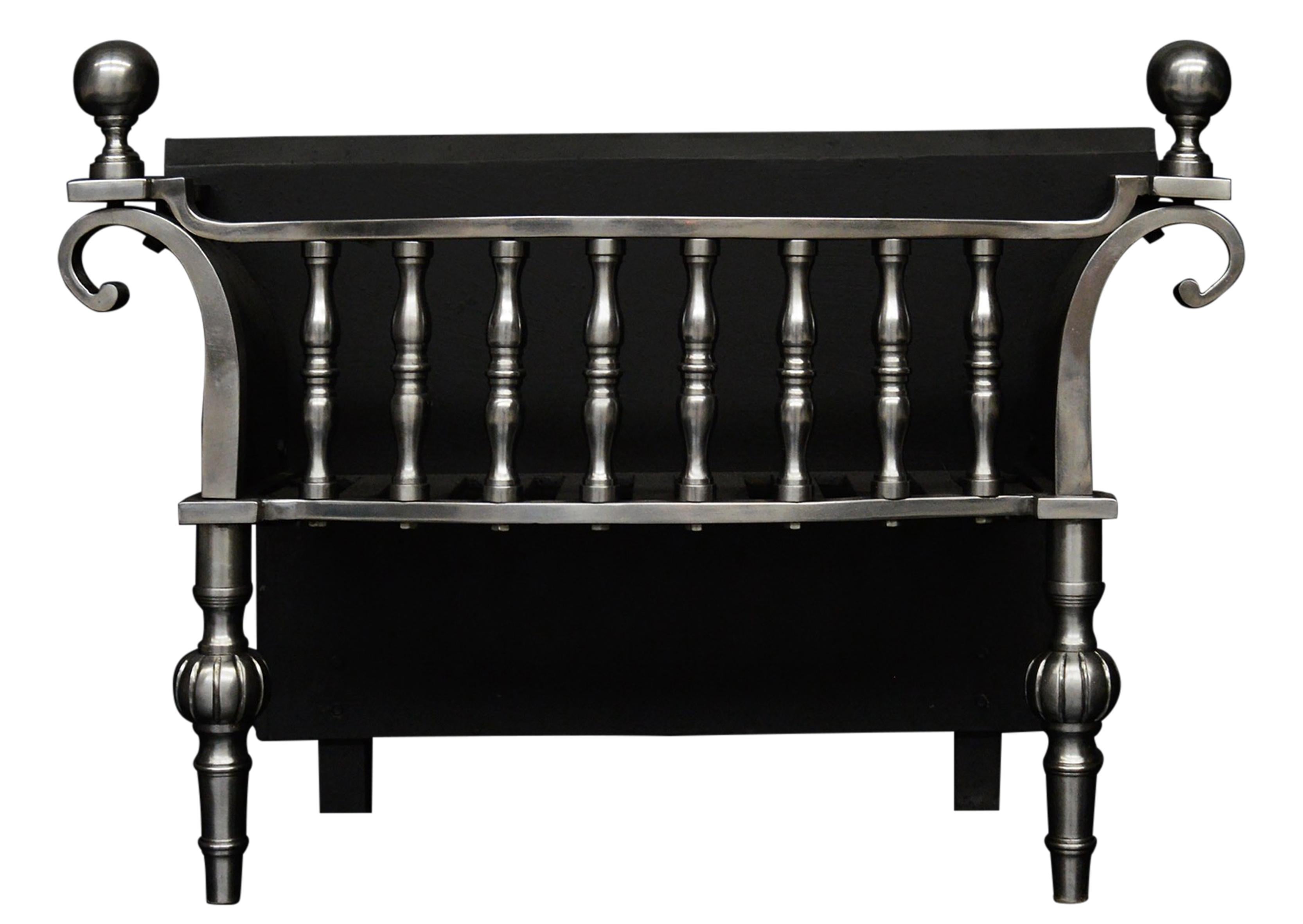 A George II style polished steel firegrate. The railed basket with baluster shaped finials, flanked by swept and scrolled sides, solid fret square legs and collared orb finials. A copy of an original (circa 1735).

Measures: 
Width At Front:	710 mm 