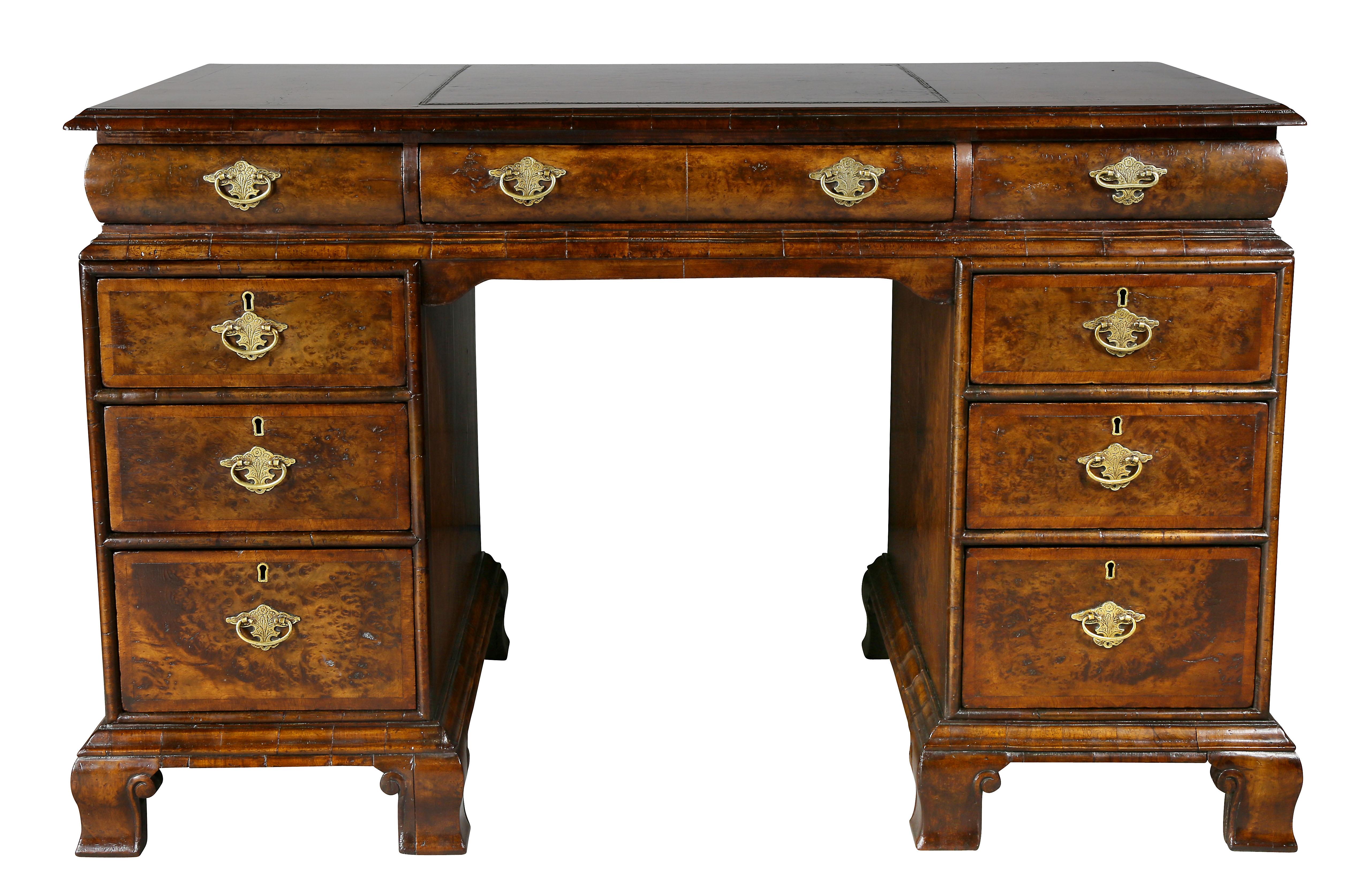 With a rectangular top with inset leather over a cushion frieze with three drawers, bases comprise pedestals containing drawers, bracket feet. Comes apart in three sections.