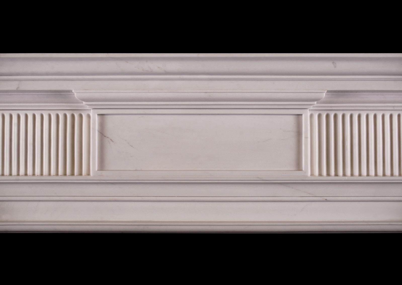 An elegant George II style fireplace in white marble. The fluted frieze centred by plain panelled tablet, the bracketed jambs carved with guilloche decoration. Moulded breakfront shelf. English, based on a period original. Modern. 


Shelf