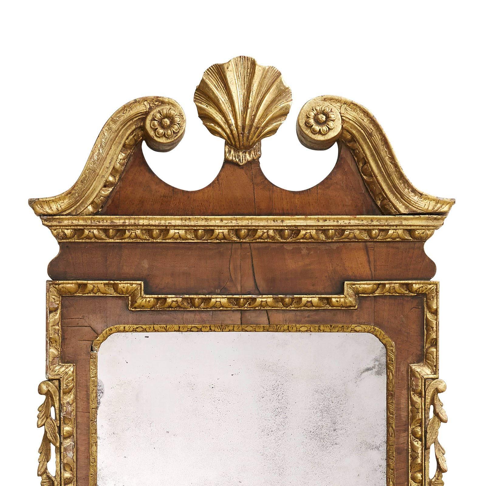 A good George II period walnut and gilt mirror with original mirror plate.  Purchased from Louis Fenton.  Restoration to shell otherwise an outstanding piece.  