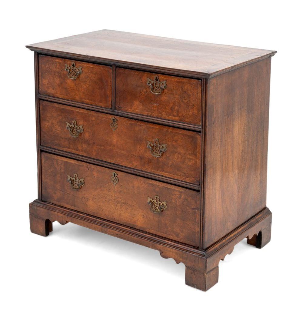George II Walnut and Feather-Banded Chest of Drawers, 18th century, two short drawers above three frieze drawers on four bracket feet. 34