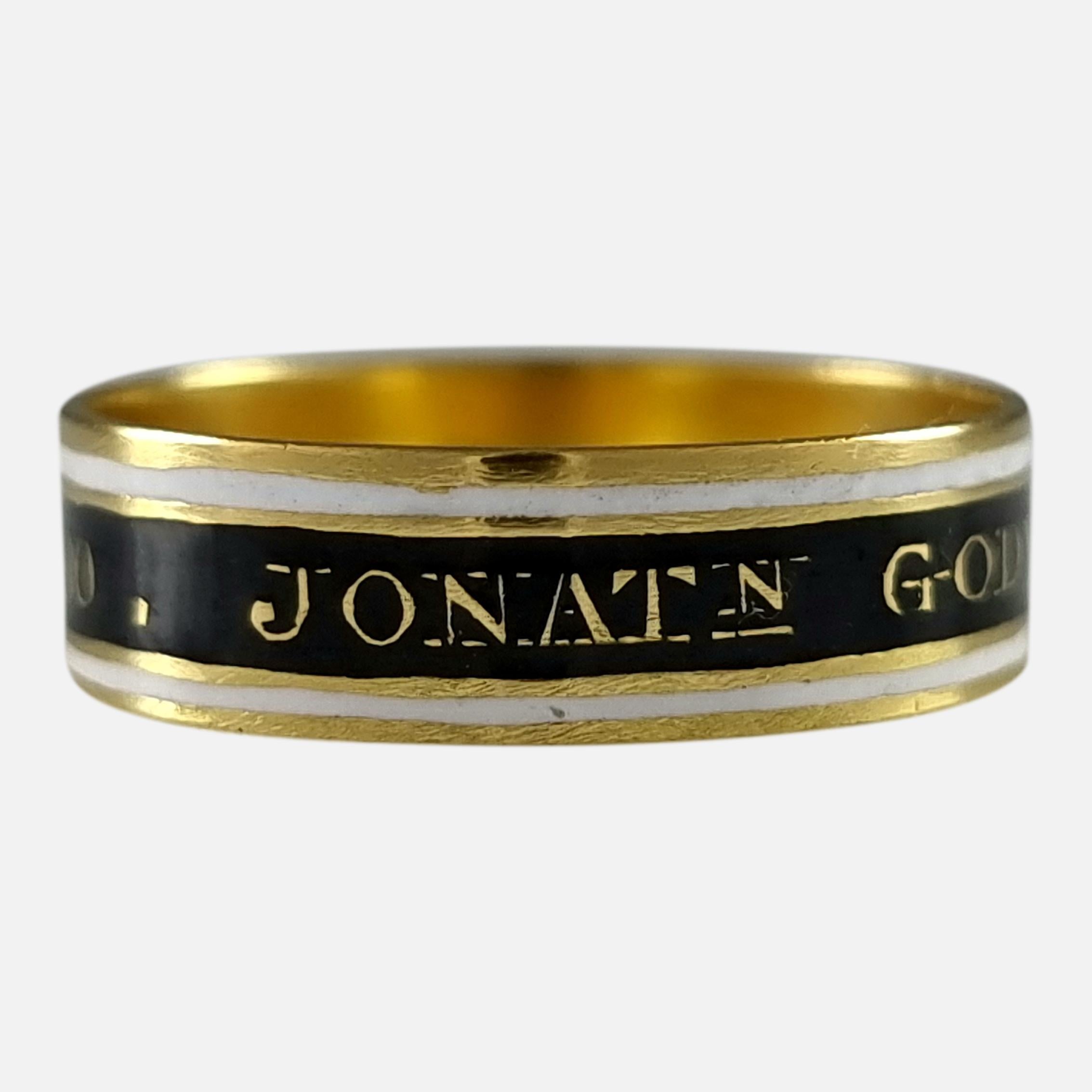 A George III 22ct yellow gold black and white enamel memorial mourning ring. The ring bears the inscription 'JONATṈ GODWIN·OB:21·JULY·1795·AE:80.' to the exterior of the band.

The ring is hallmarked with the duty mark, lion passant used during