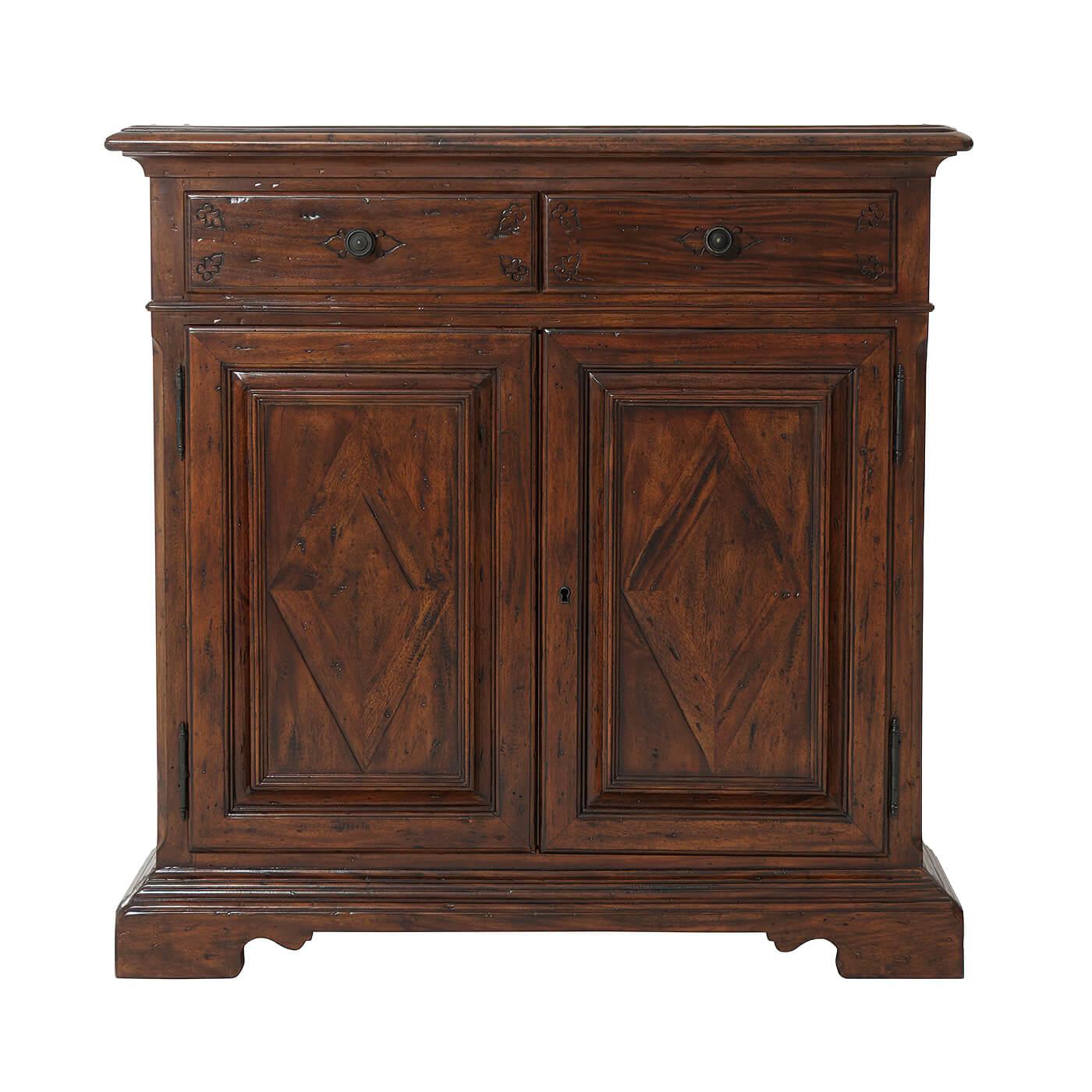 A George III style antiqued wood side cabinet, with two frieze drawers over two parquetry cabinet doors enclosing an adjustable shelf on a molded base with bracket feet. 

Dimensions: 37.75
