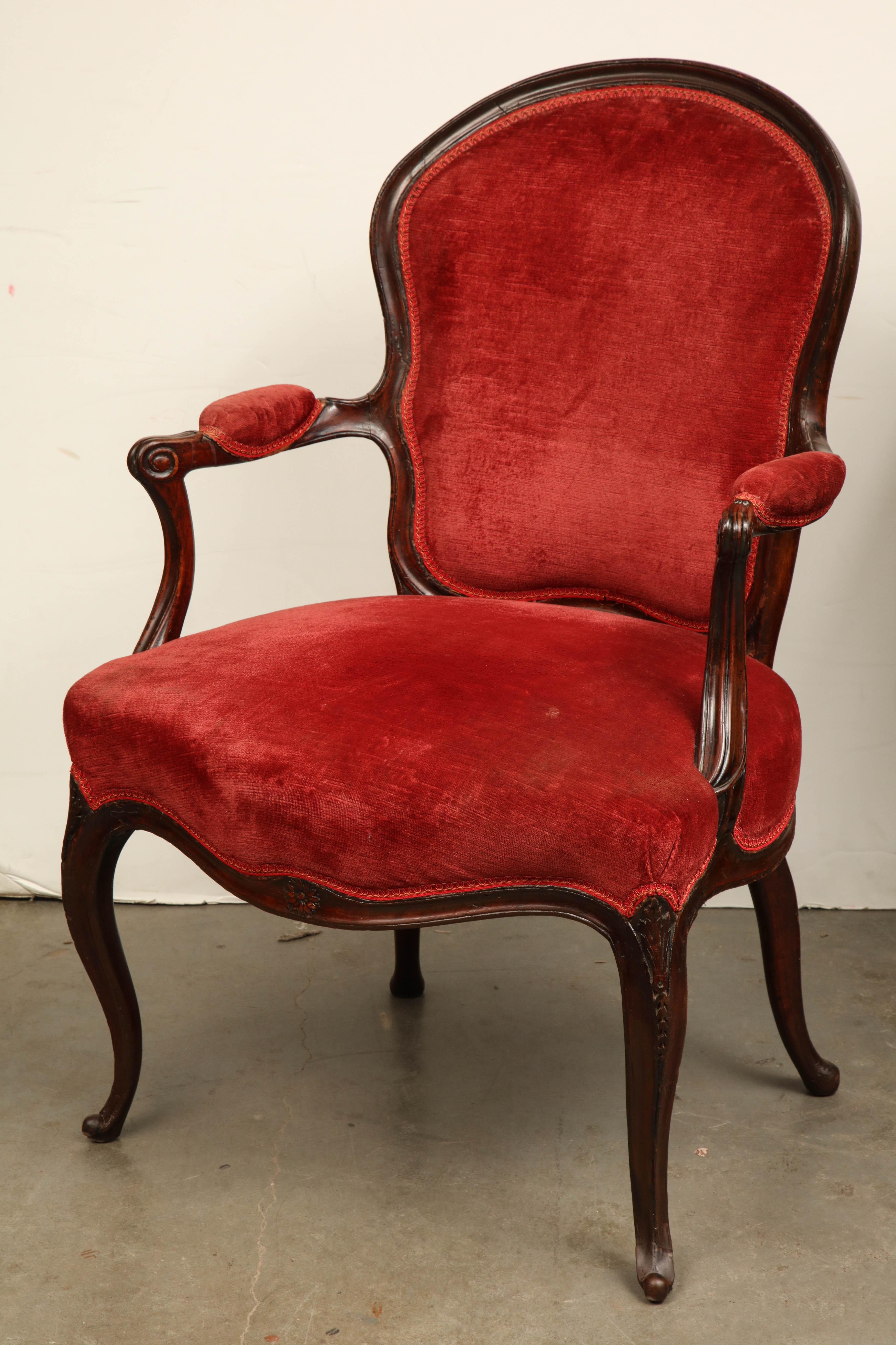 English George III (Hepplewhite) mahogany open armchair in the French toast with rosettes and scroll cabriole legs.