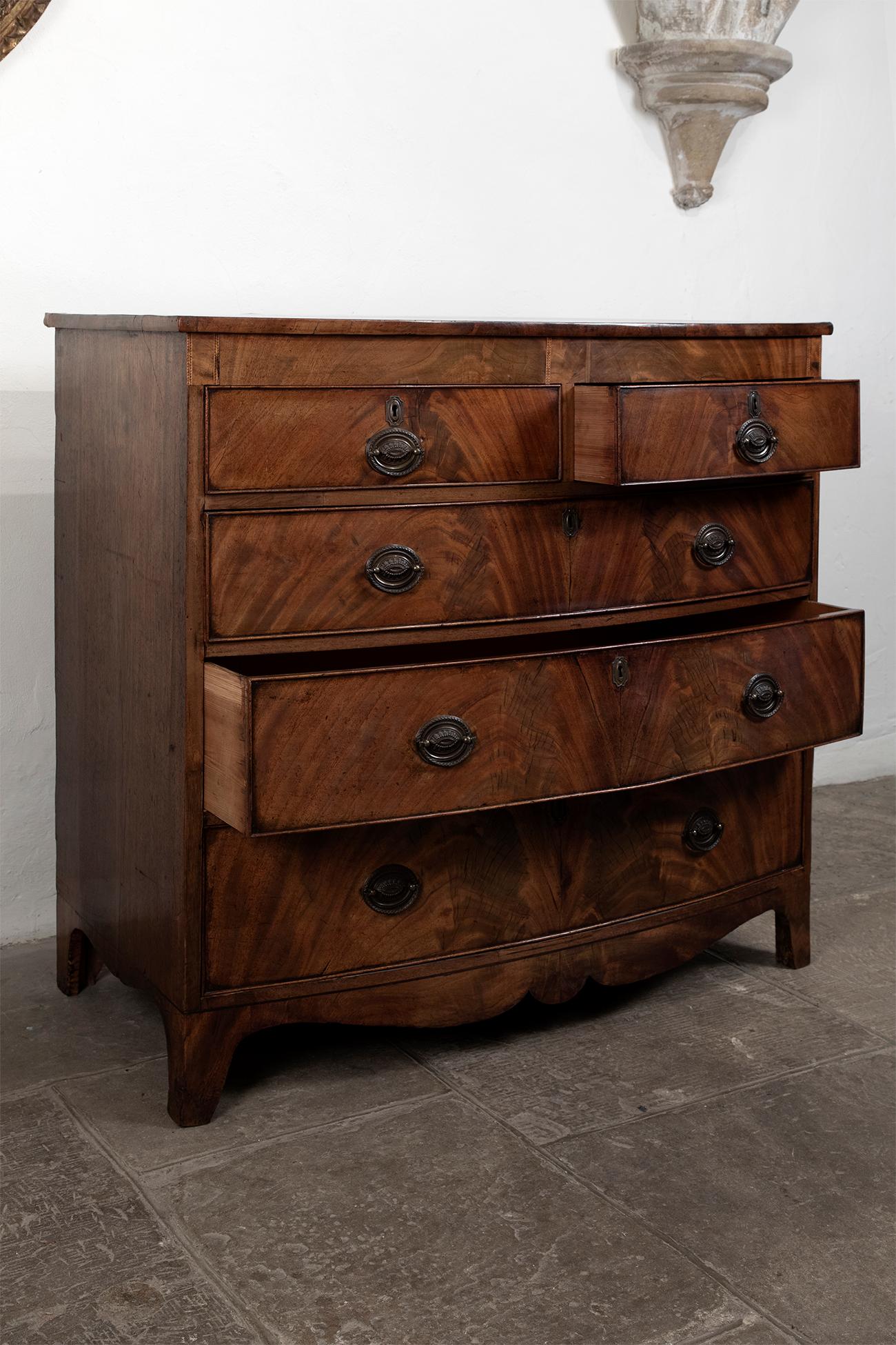 British George III Bow Fronted Flame Mahogany Chest, circa 1790