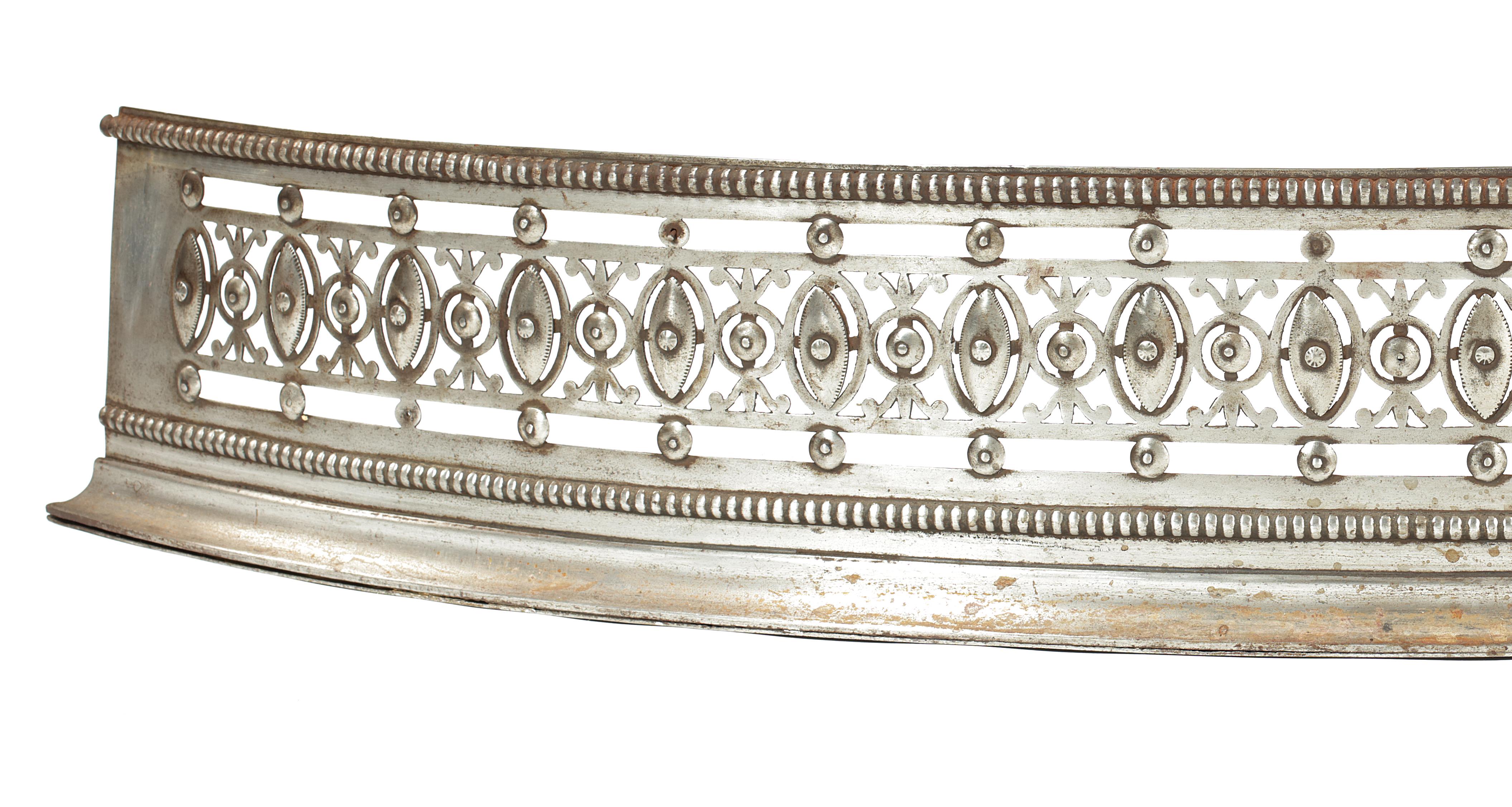The beaded edge above a pierced leaf frieze applied with roundels and ovals, on a moulded base.