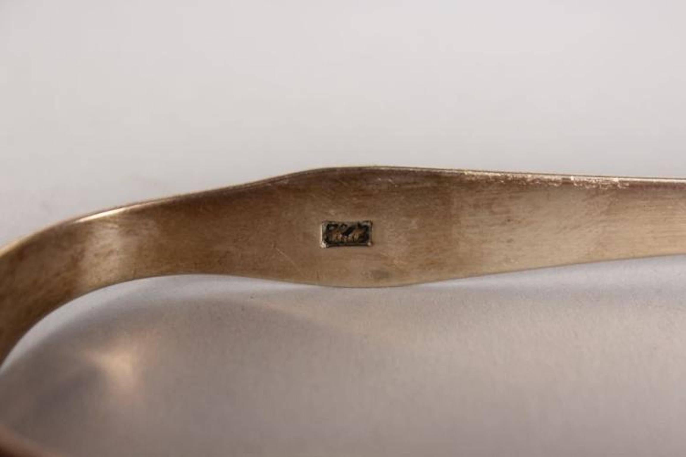 A George III bright cut pair of sugar tongs by Hester Bateman.