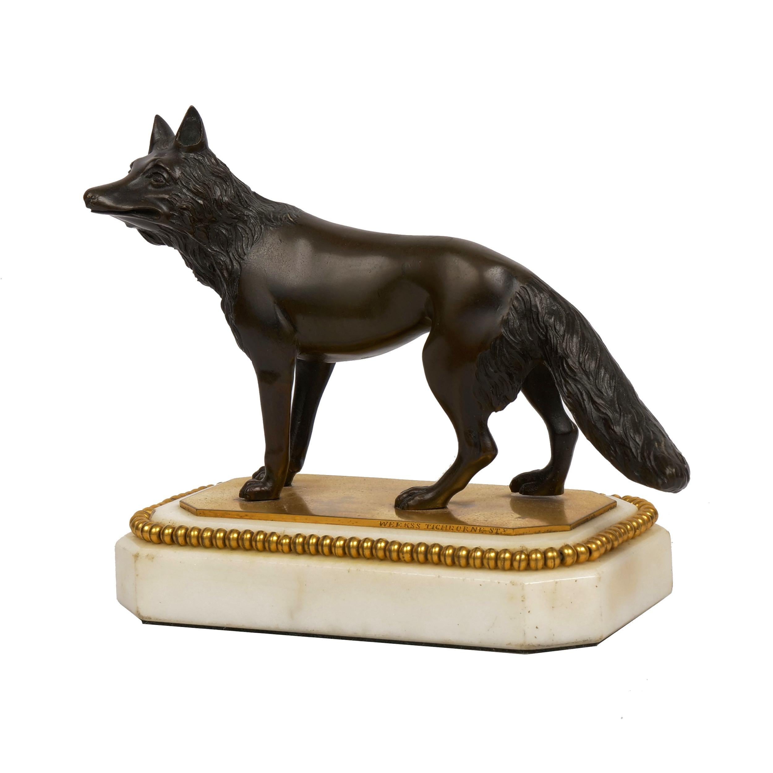 GEORGE III PATINATED FIGURAL BRONZE AND MARBLE PAPERWEIGHT
A standing fox; engraved 