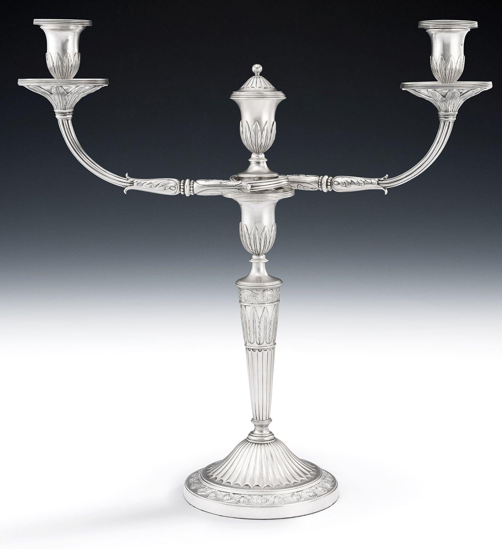 An important & exceptional George III Candelabrum made in London in 1793 by Edward Fernell.

This very fine piece is modelled in the unusual Neo Classical tradition.  The base is circular in form and is decorated with a domed bat wing fluted