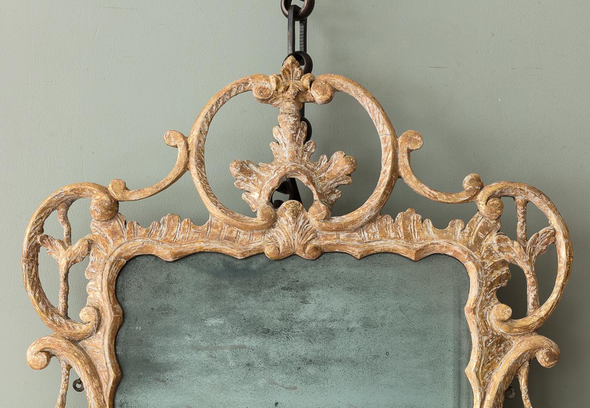 A George III Carved and Giltwood Mirror

With extensive c-scroll and acanthus finely carved detailing, and gently shaped giltwood frame, the surface carefully dry stripped to reveal the original gilt remnants showing an original and soft ‘sleepy’
