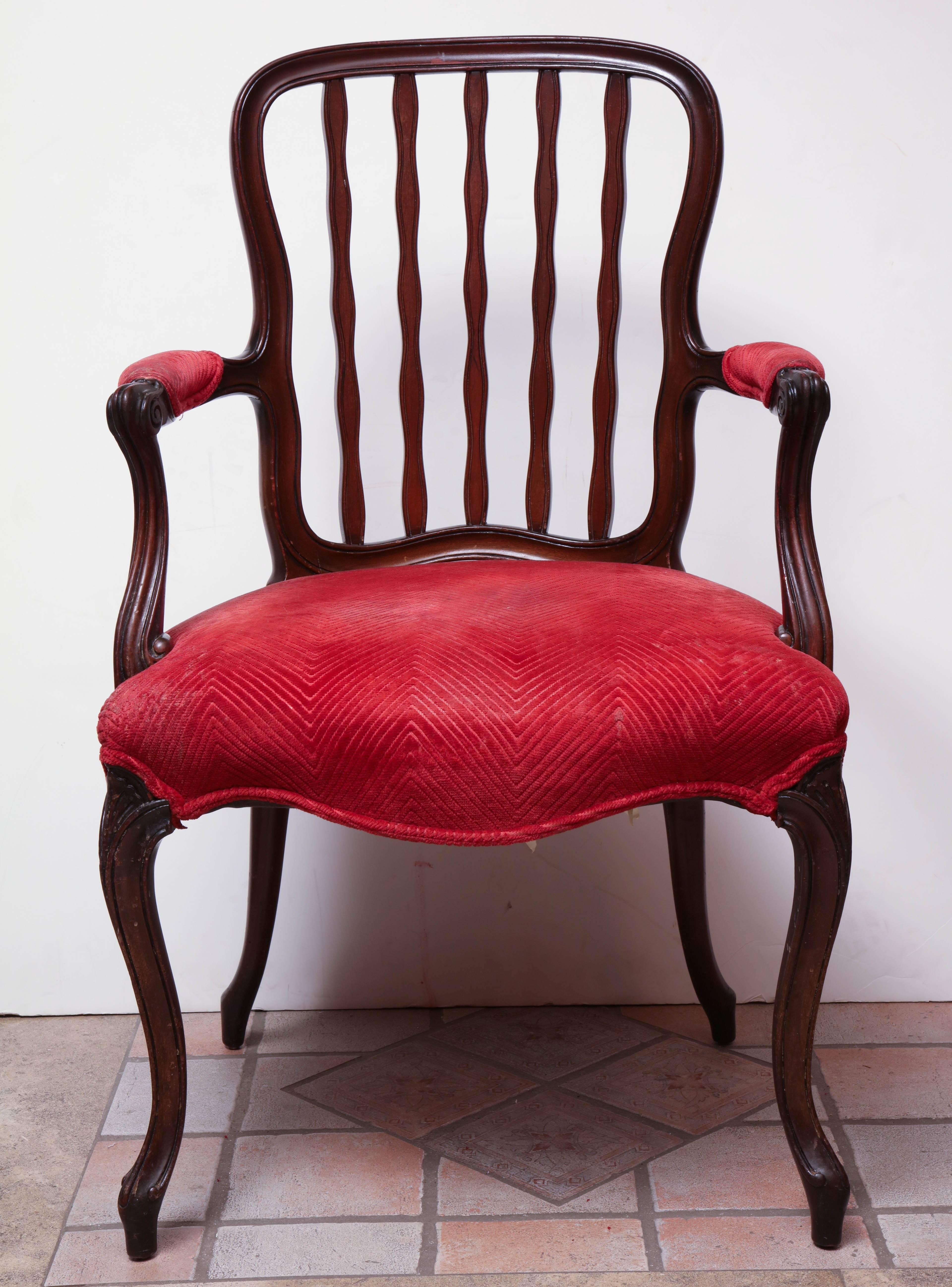 English George III carved mahogany armchair with cabriole legs.