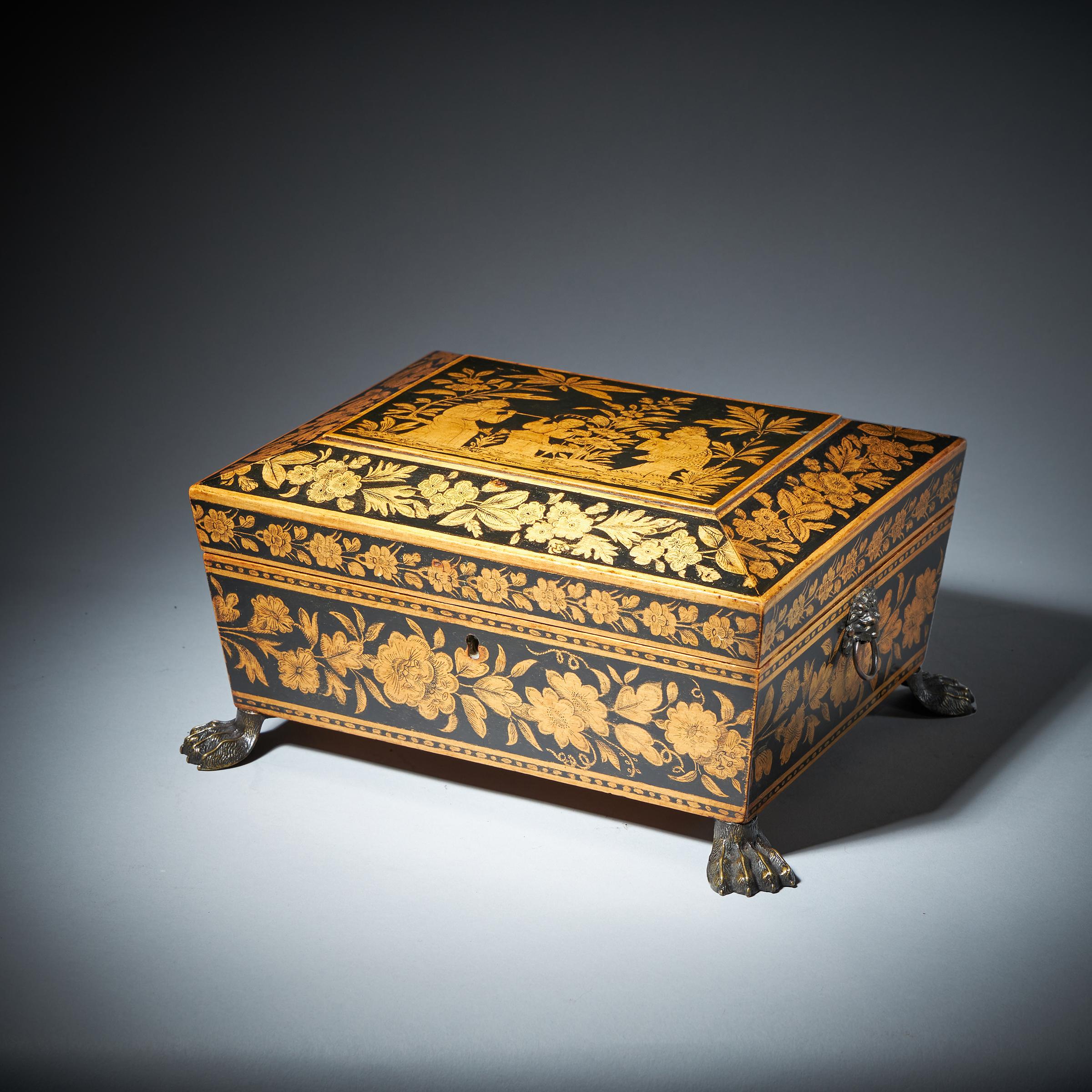 An exemplary George III chinoiserie and floral design penwork jewellery box, dated 1816. 

This superb example in flawless condition is incredibly well decorated onto sycamore, depicting a floral frieze bordered by linear stringing, raised on hairy