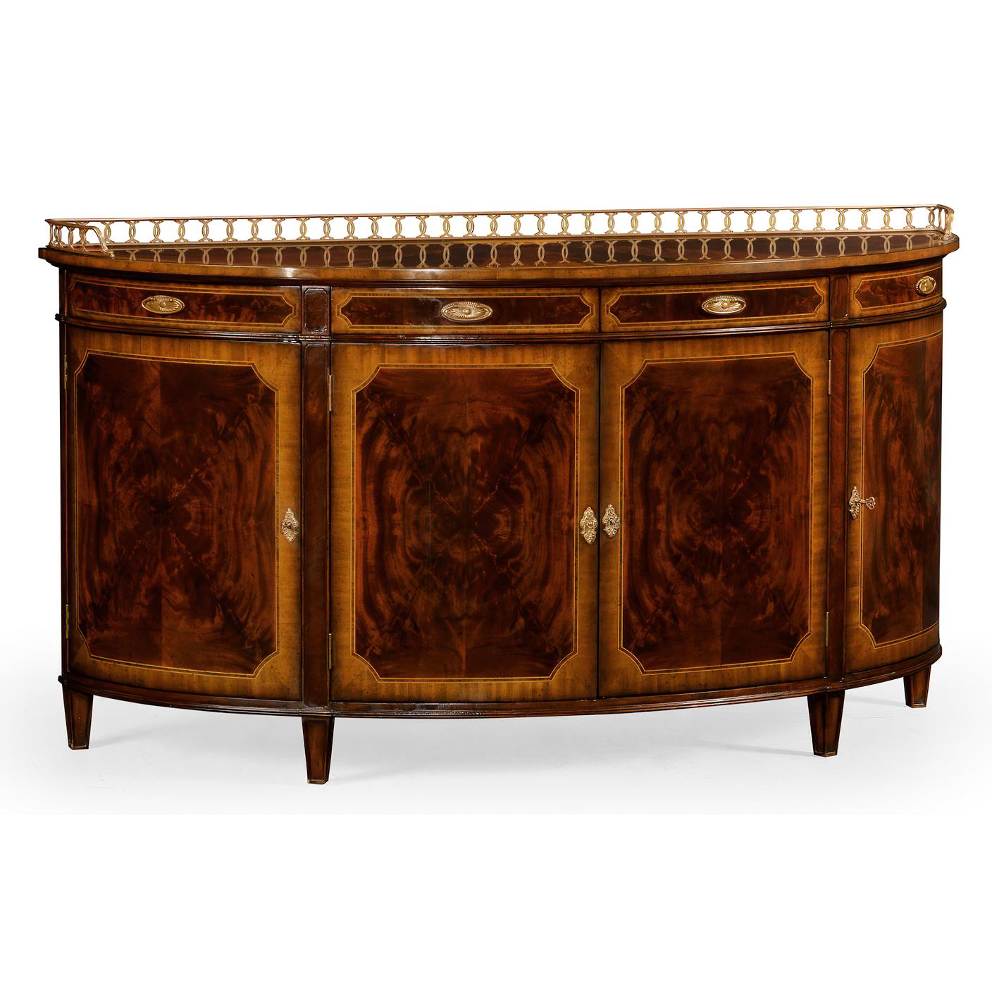 Substantial George III style demilune sideboard or buffet with four doors, adjustable shelves within, and a frieze of four drawers. Fine crotch mahogany veneers and crossbanding both on the outside and inside the curved doors. Pierced patinated
