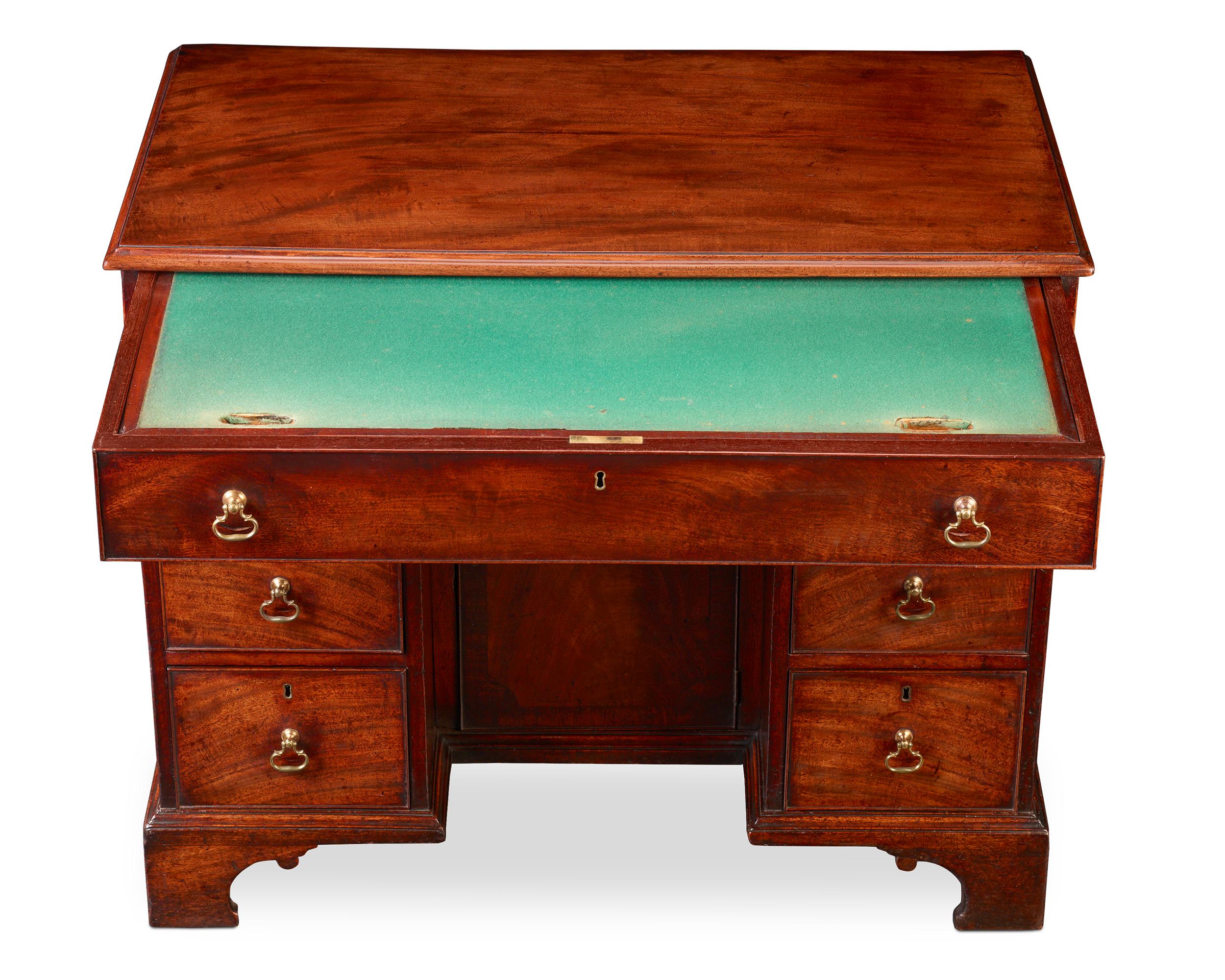 This exceptional kneehole dressing table by the workshops of Thomas Chippendale displays all of the hallmarks of furnishings crafted by the master’s hand. This mahogany table is complete with its original brass handles and bears Chippendale's