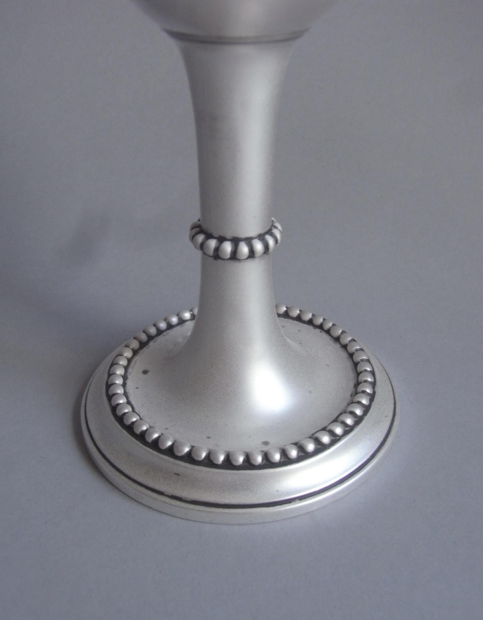 An unusual George III Drinking Goblet made in London in 1772 by Richard Morson & Benjamin Stephenson.

This very unusual piece stands on a circular pedestal foot decorated with bold applied beading. The baluster vase shaped main body has a gilded