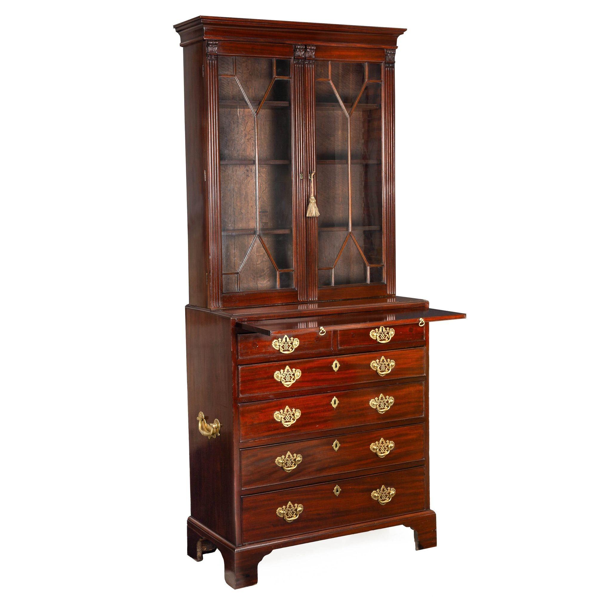 GEORGE III MAHOGANY DIMINUTIVE SECRETARY WITH BOOKCASE
England, circa 1780
Item # 307PZN13W 

A very fine secretary desk of diminutive proportions, this fabulous form features an upper bookcase with a cove-molded cornice over a pair of glazed doors
