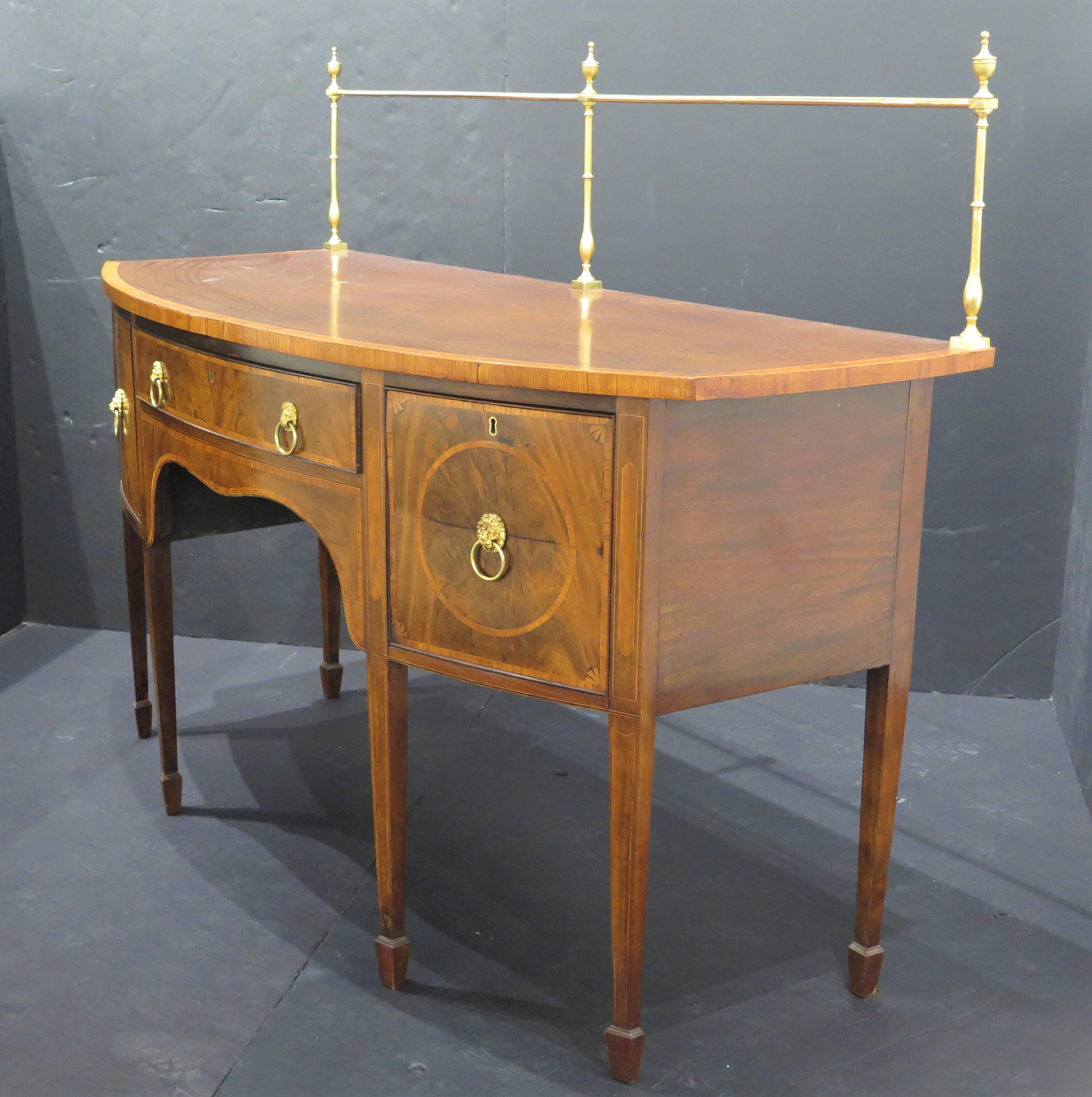 George III English inlaid mahogany Hepplewhite-style sideboard / server, banded bow front top with split down center, over conforming base with long center split down center by two deep drawers, raised on square tapered pencil legs banded and string