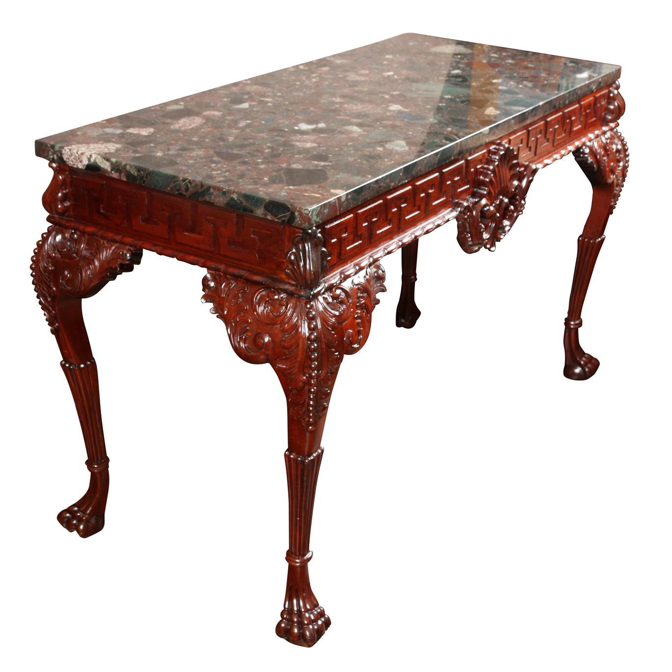 George III English mahogany console table with rare marble top. Greek key detail carved in table apron with shell motif at center. Carved legs finish with claw feet