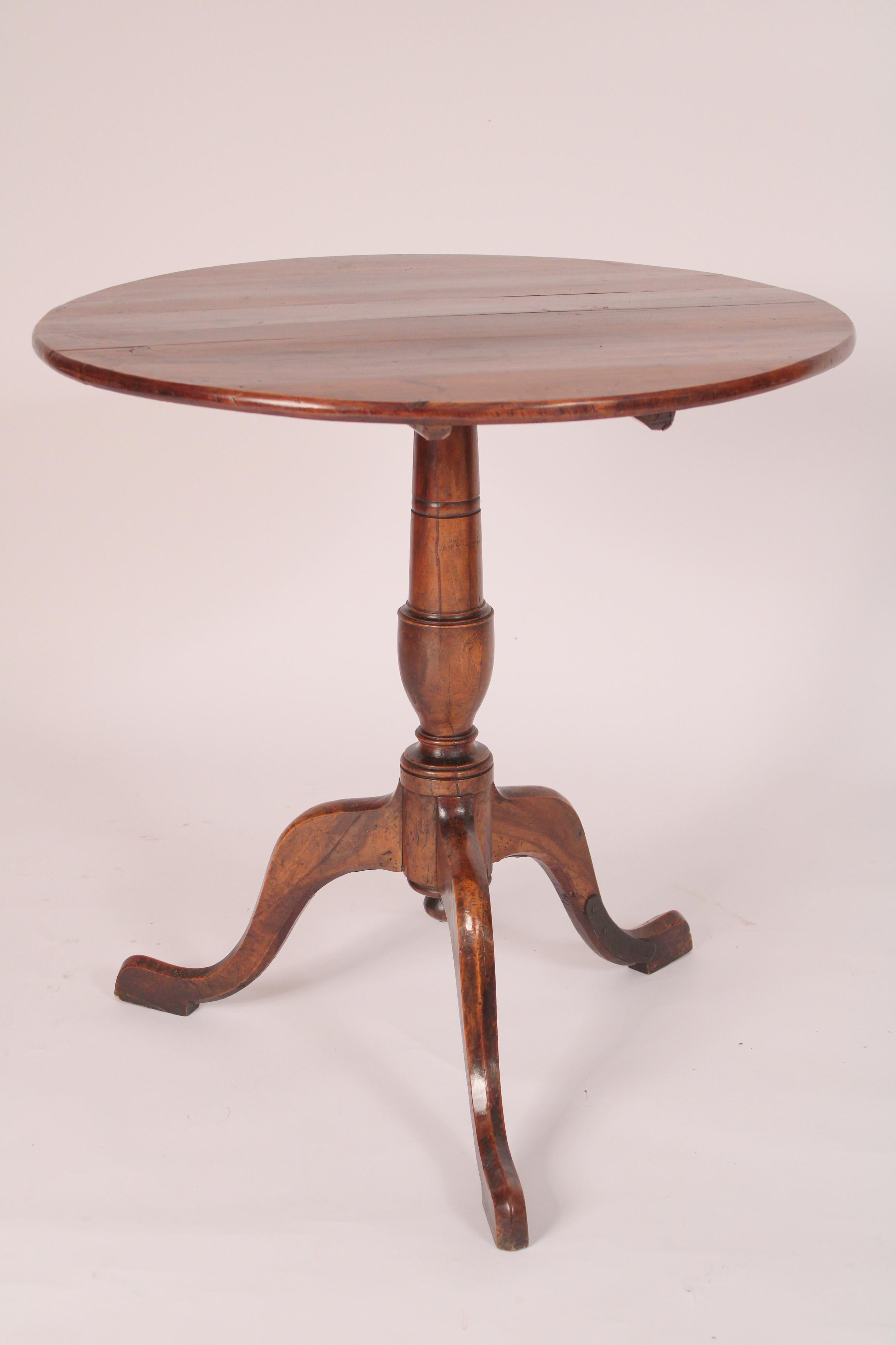 George III fruit wood tilt top table, 18th century. With a circular 5 board top, a vase shaped pedestal and 3 down swept legs. Not 100% sure of the wood it looks like yew, fruit wood or beech, nice old color.