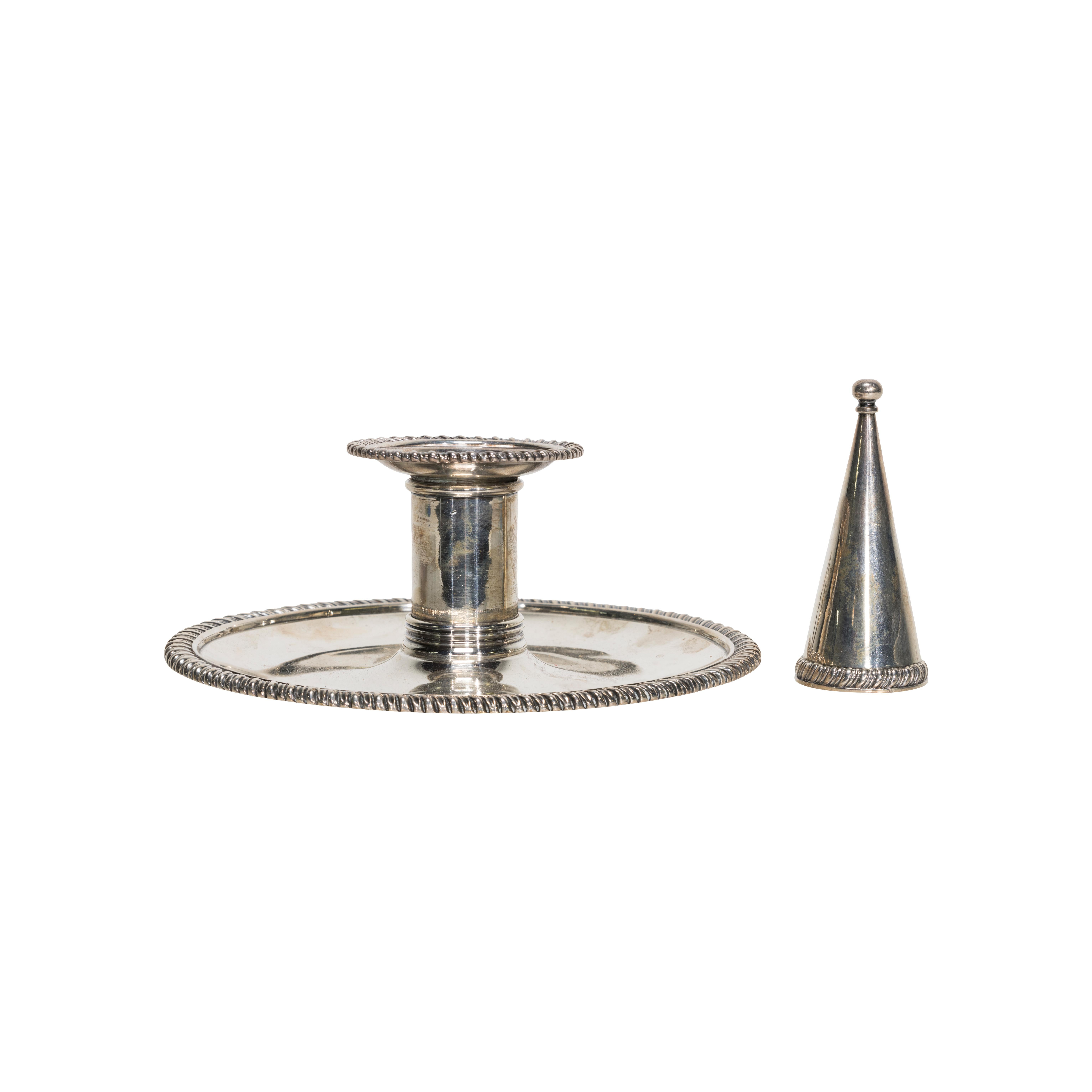 English George III sterling silver chamber candlestick by Robert Garrard II (1793 - 1881). Gadrooned border, ring handle, tray engraved with three arrows and ducal coronet, detachable candle nozzle and snuffer. London hallmarks, hallmarks illegible