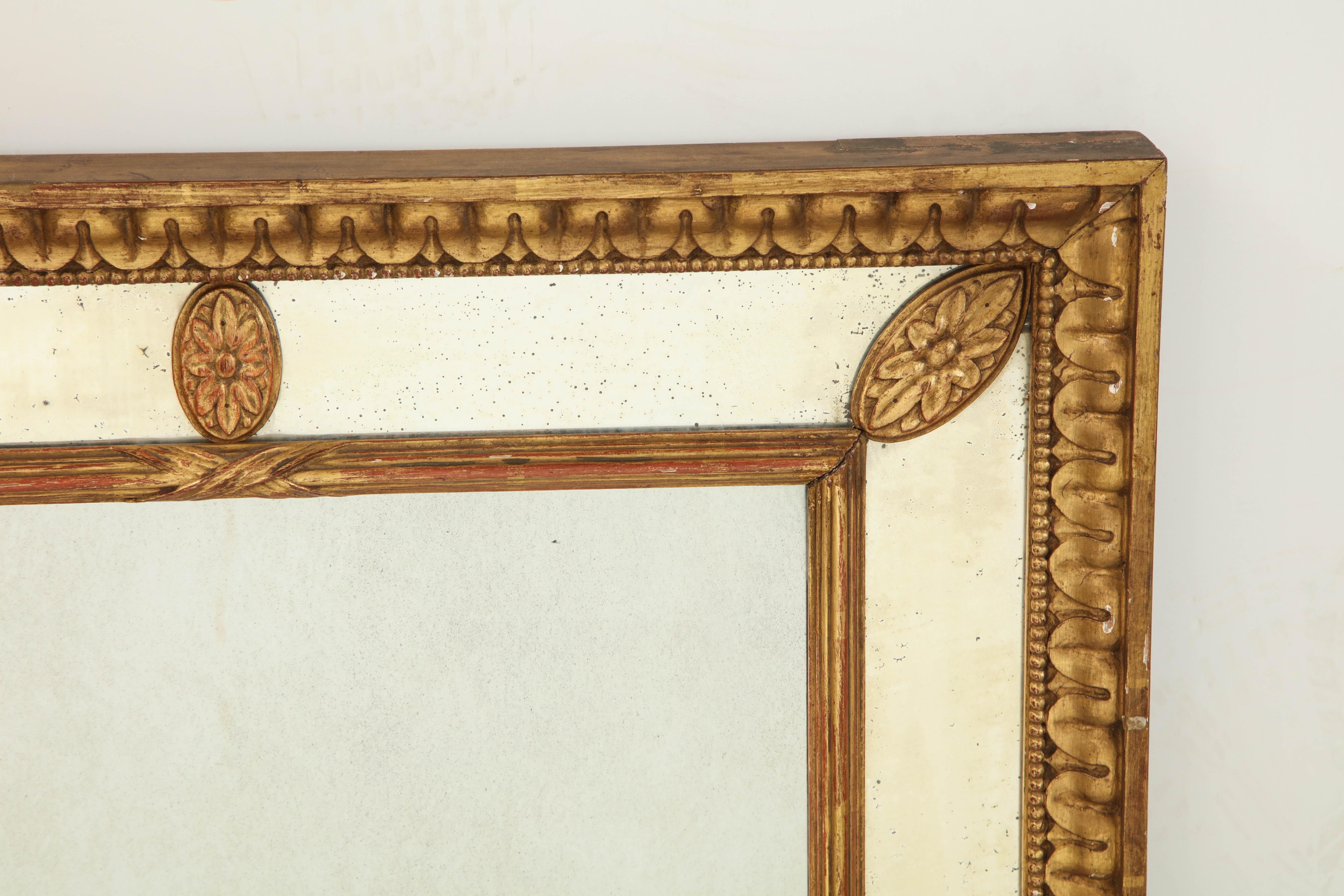 George III carved giltwood mirror with border glass frame and carved rosettes.