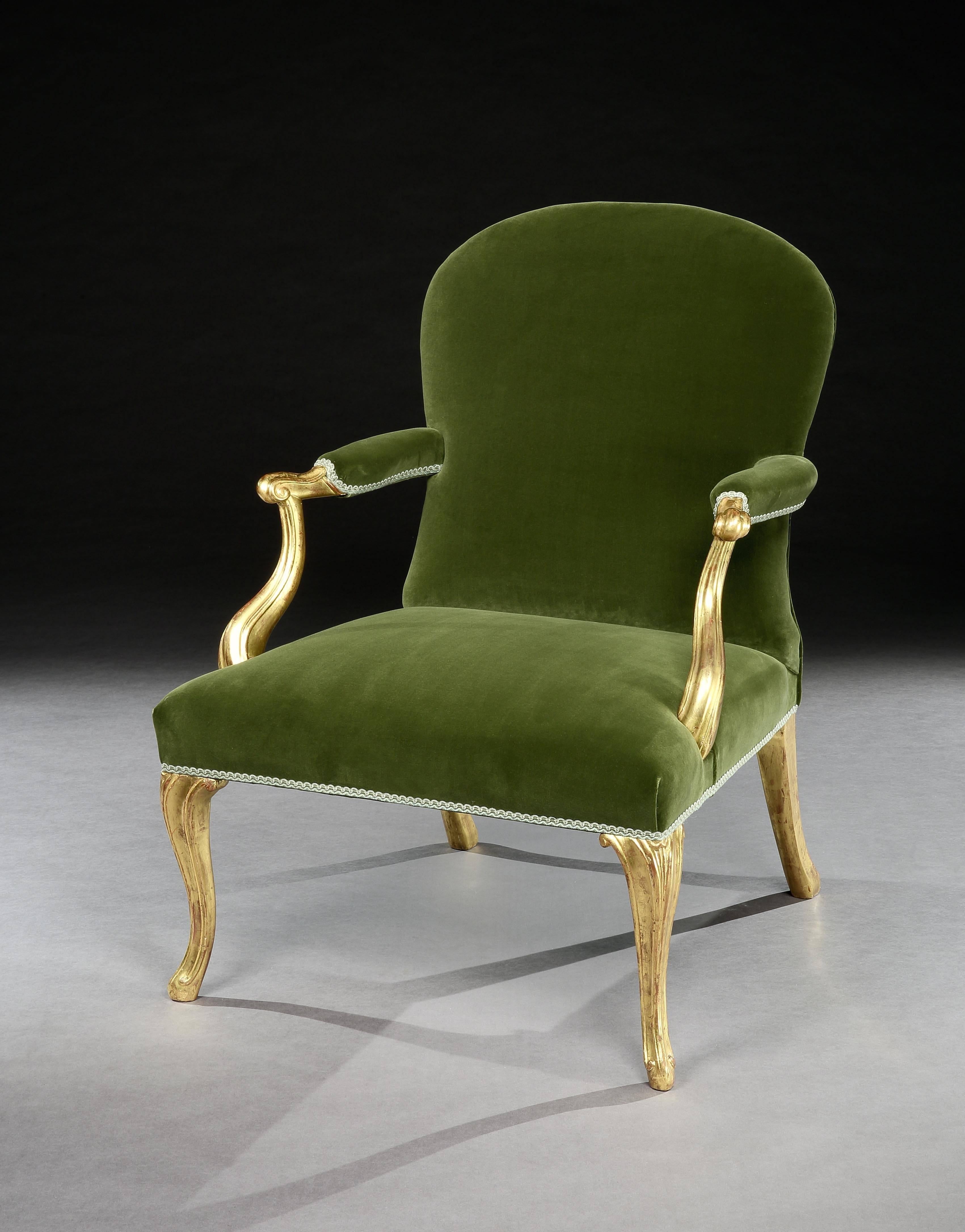 A very fine George III giltwood armchair, the padded back and seat upholstered in light green damask.