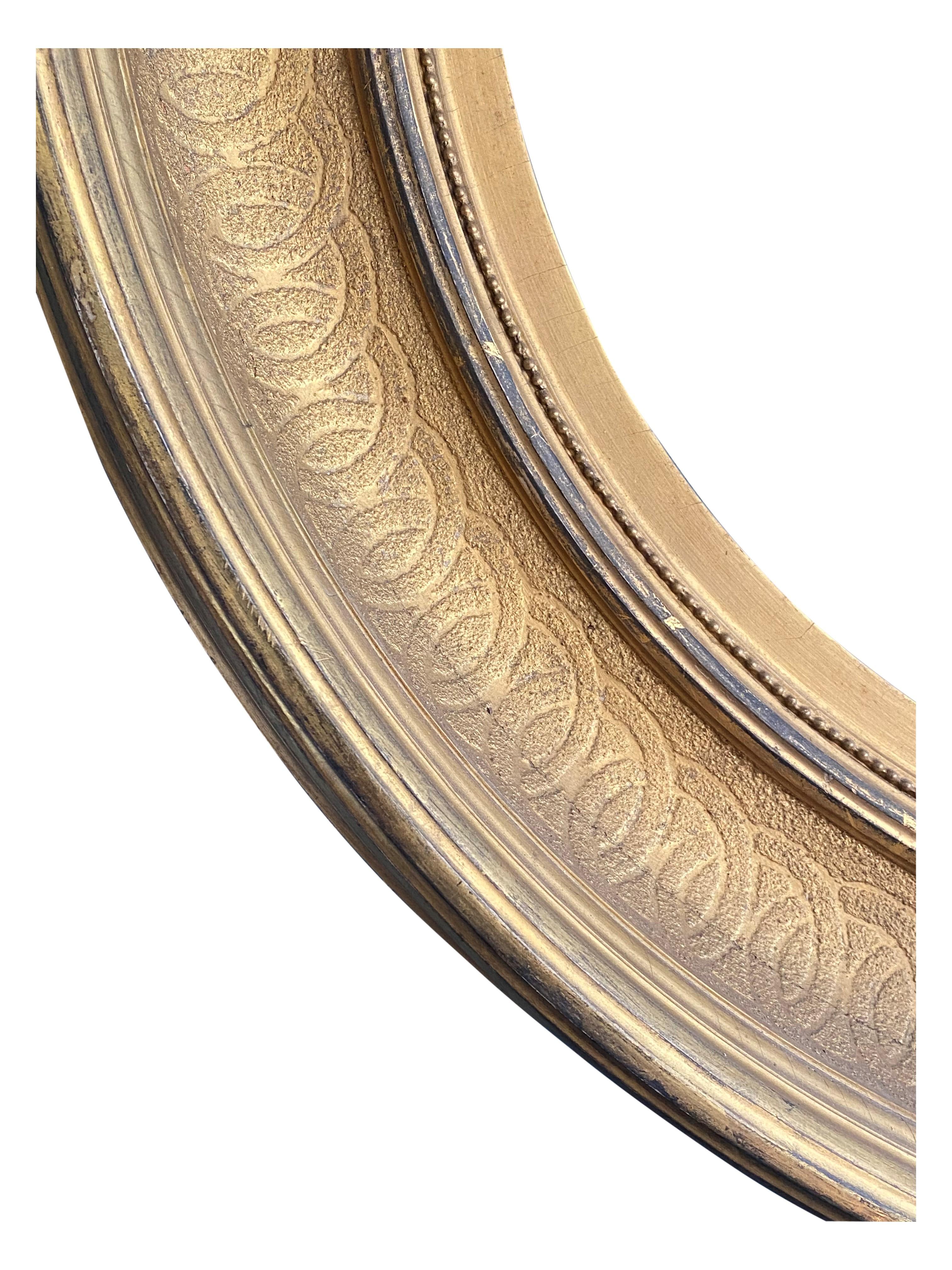 Sadly lacking the mirror plate although this could be used as a very elegant circular picture frame. Having incised ornament and much of the original gold leaf. Note never had peripheral elements. Diameter of mirror plate would be about 20